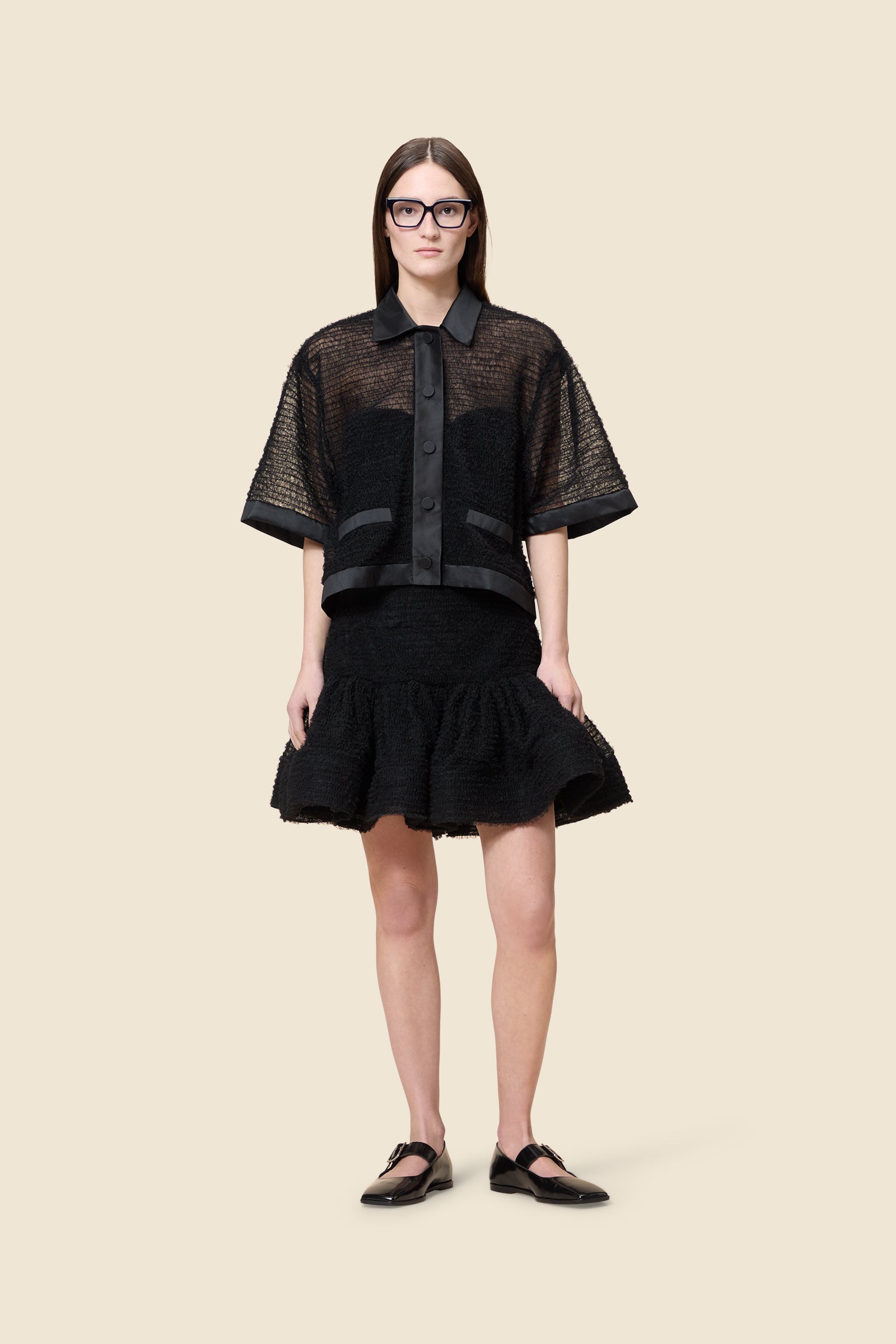 Inspired by the tulle from the ‘late stage capitalism waltz’ haute couture collection, the shirt features hand crafted tulle ruffles for a feminine texture