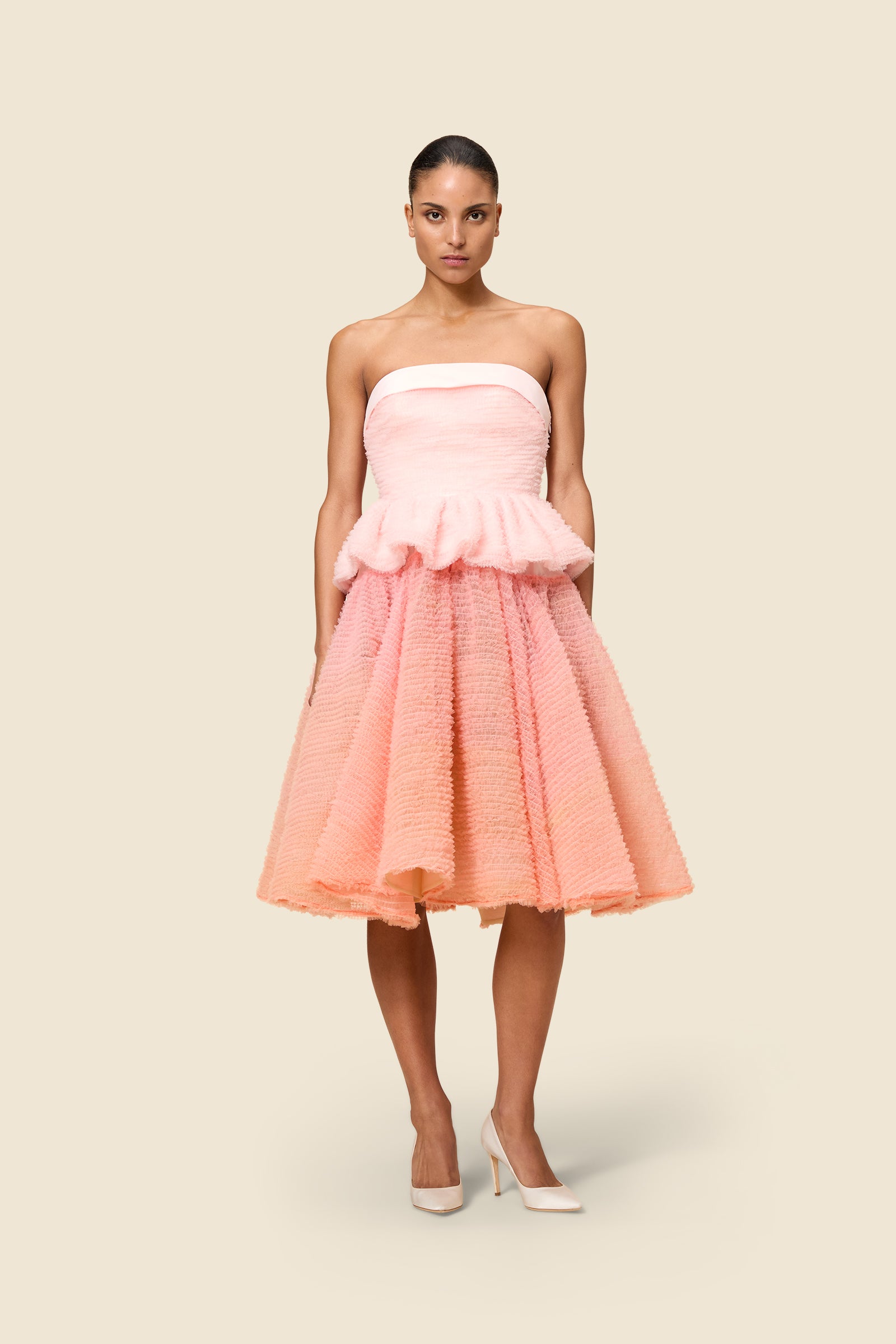 Inspired by the tulle from the ‘late stage capitalism waltz’ haute couture collection, the top features hand crafted tulle ruffles for a feminine texture