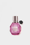 Pretty Peony flowerbomb perfume in a pink bottle on a white background.