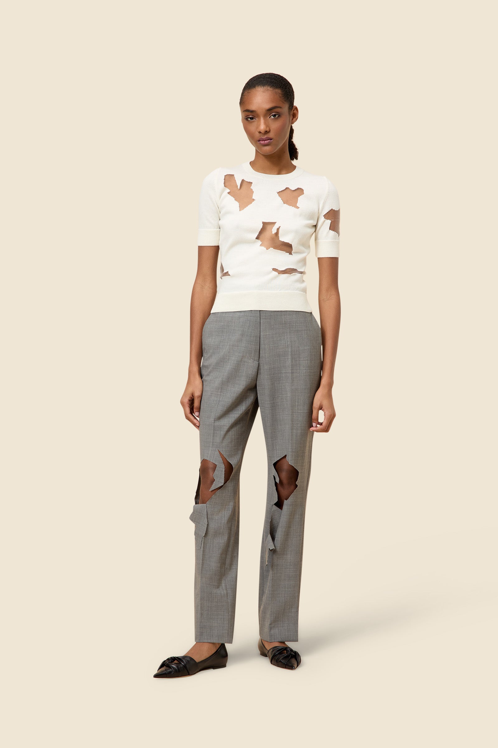 The laser cut hemlines and pleated japanese bonded satin embrace vitkor&rolf's scissorhands signature details in a dress