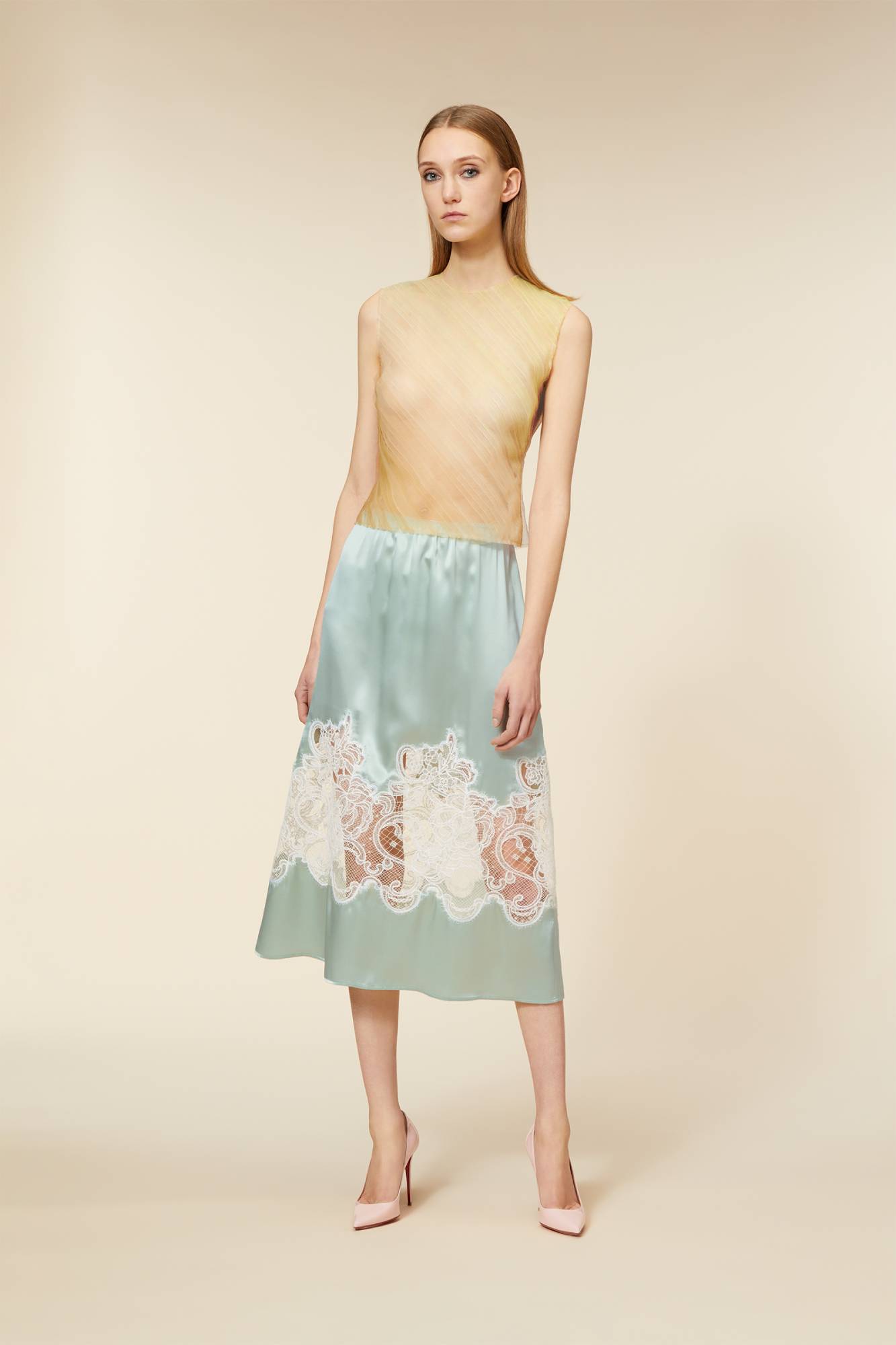 Crafted with delicate haute couture-inspired tulle, the top captures the essence of dreamlike elegance with subtle fabric movement