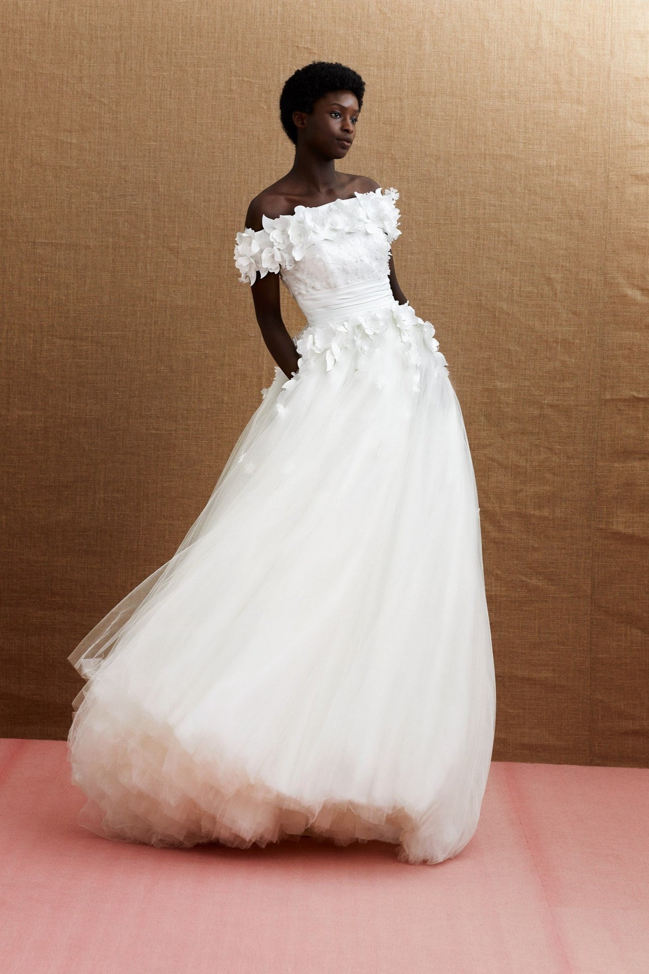 Off-shoulder tulle ball gown with a satin bodice