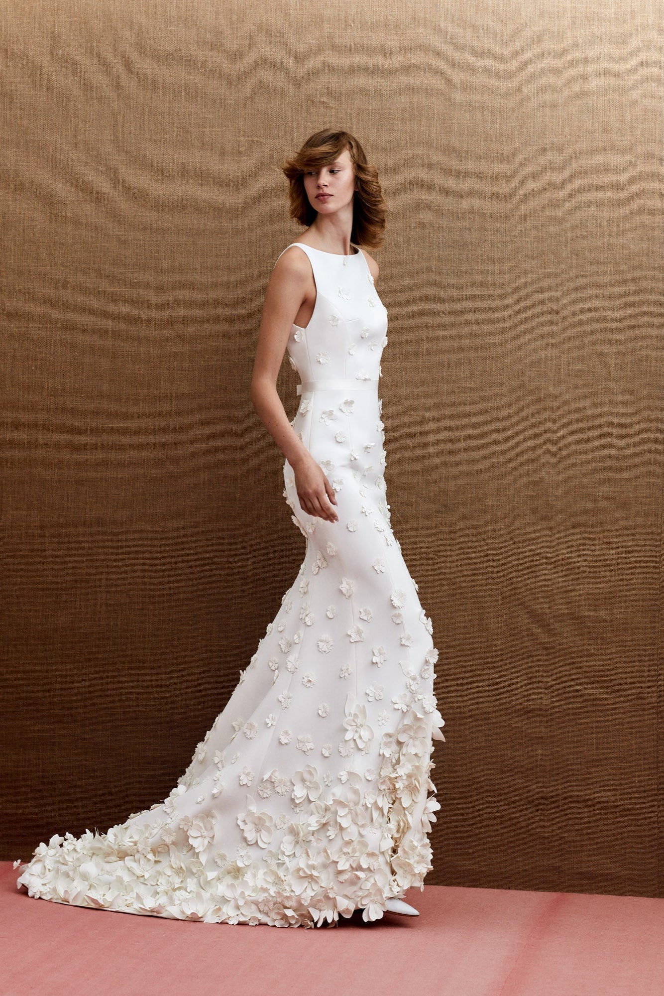 Timeless elegant mermaid silhouette with an intricate boat neck and slim shoulder straps, opening into a plunging v-neck back