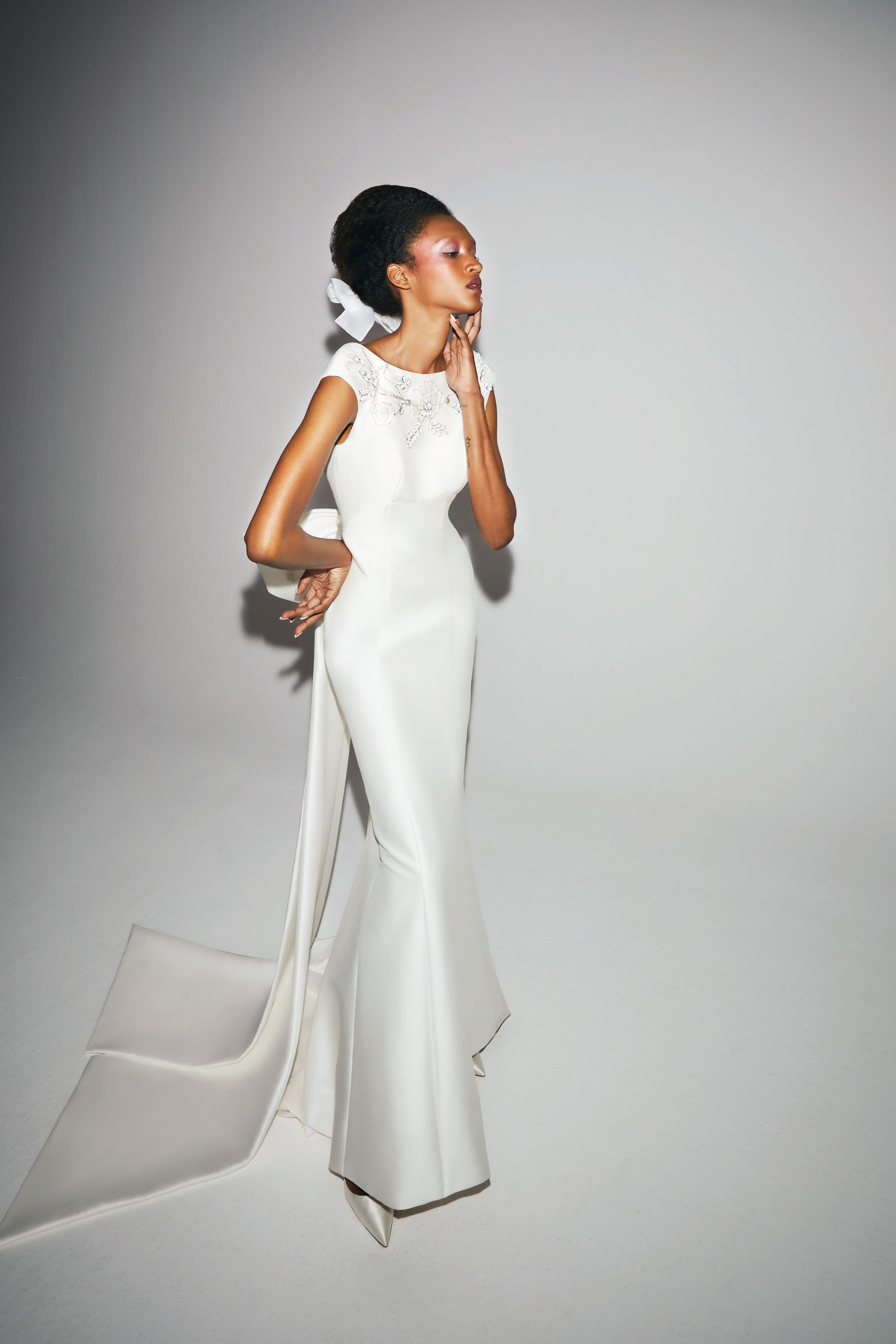 Chic mermaid gown with empire seaming crafted from mikado with a slight stretch which allows the dress to perfectly sculpt the wearer’s body