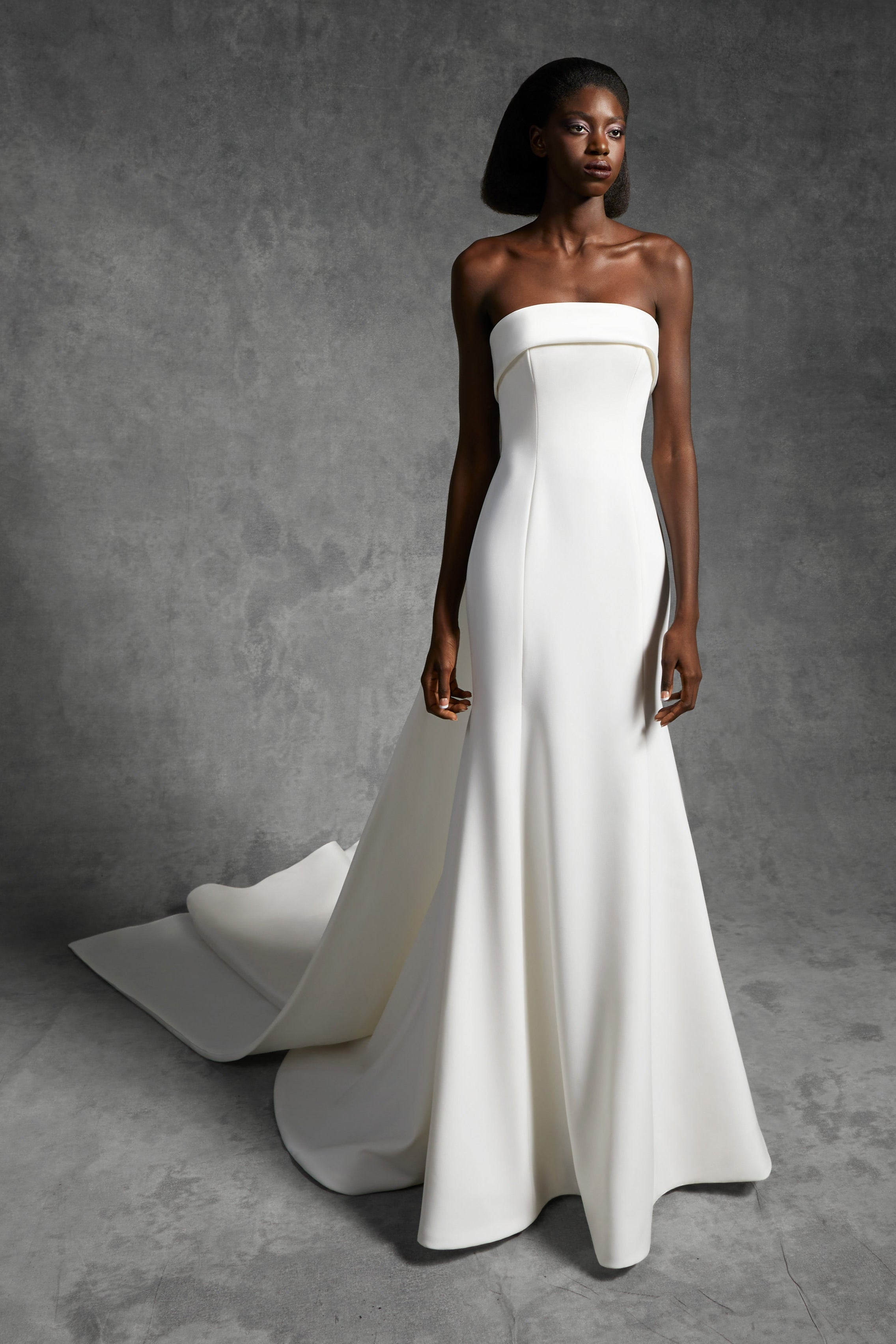 Graphic, strapless mermaid silhouette with a clean band crafted from crepe with a slight stretch that sculpts the wearer's body