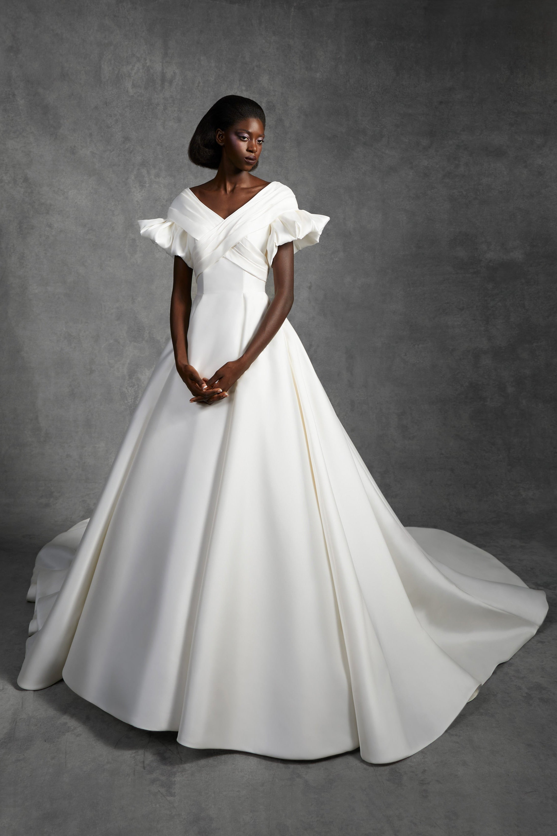 Timeless a-line gown featuring a v-neckline crafted from soft mikado