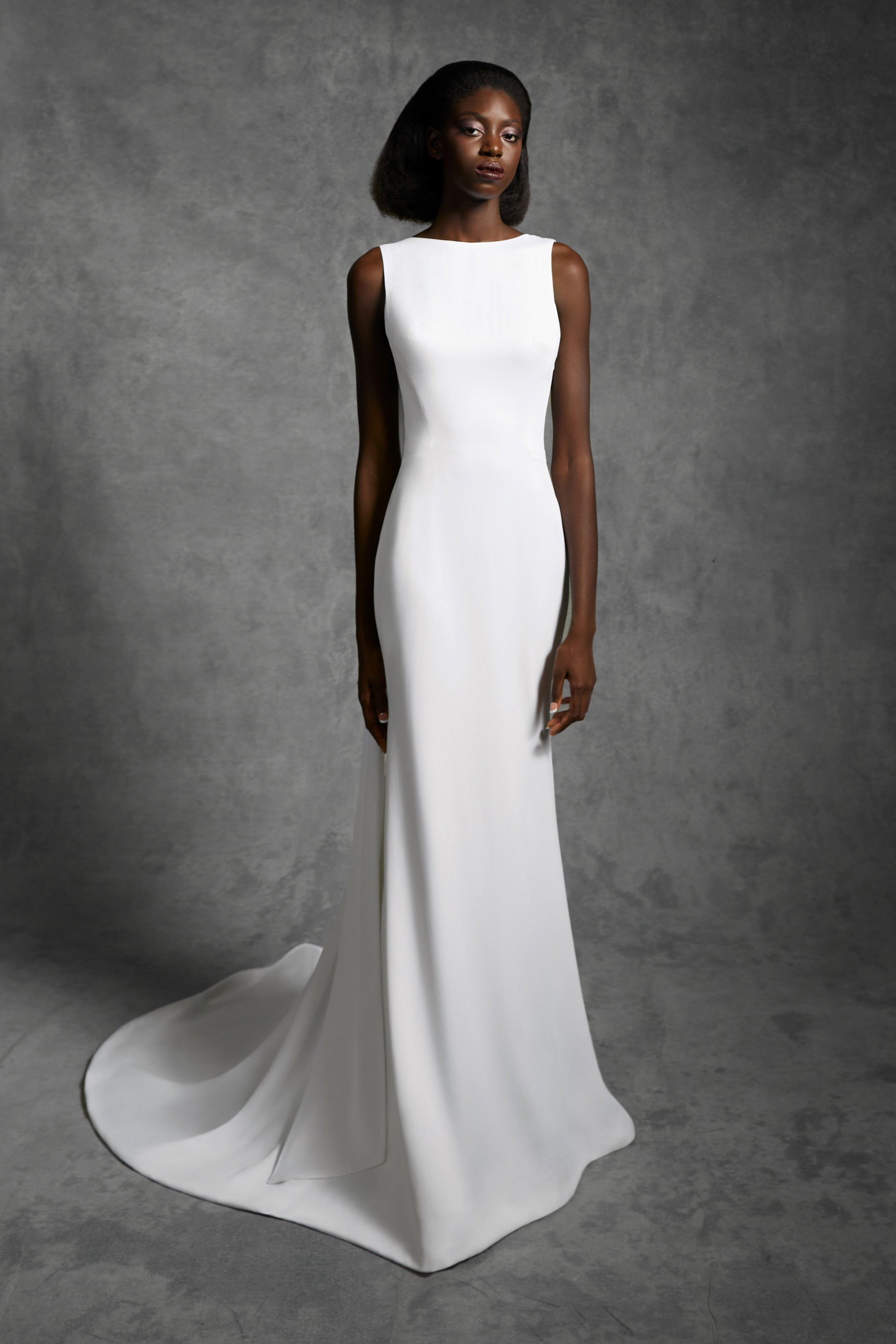 Column gown with a statement draped open back and a signature viktor&rolf tilted bow that leads way to an elegant train