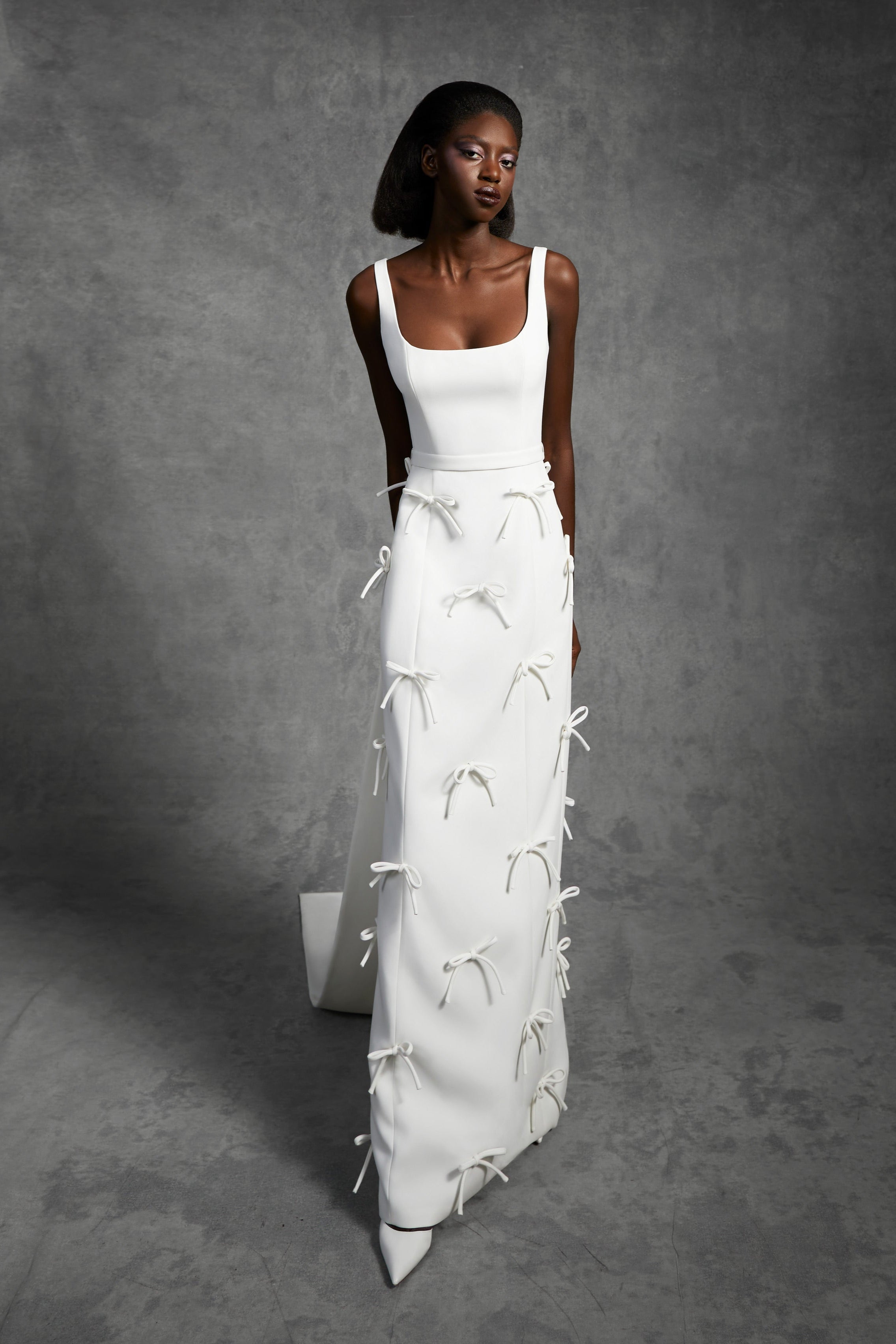 Timeless empire gown with a classic squared neckline and empire waistband, crafted from double-faced crepe with a matte finish