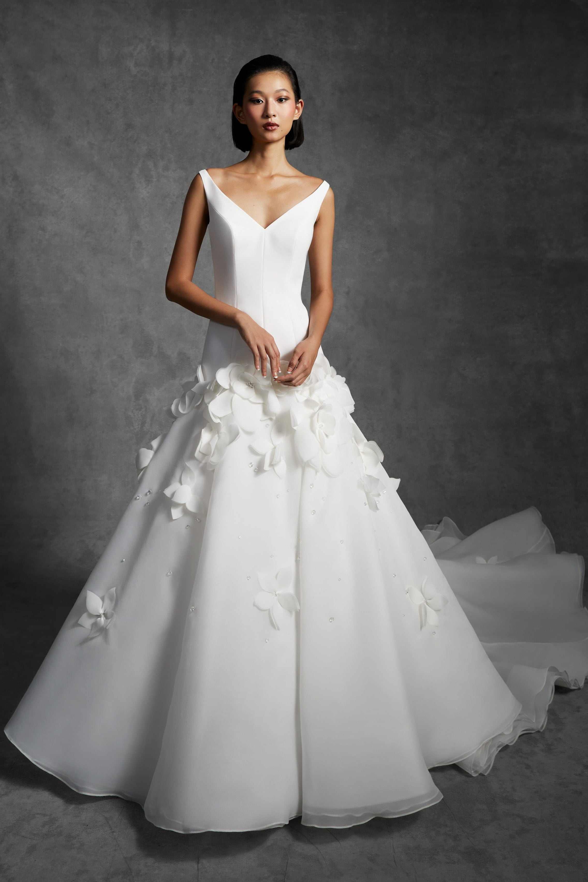 Chic mermaid silhouette with a clean crepe bodice that delicately sculpts the wearer's body