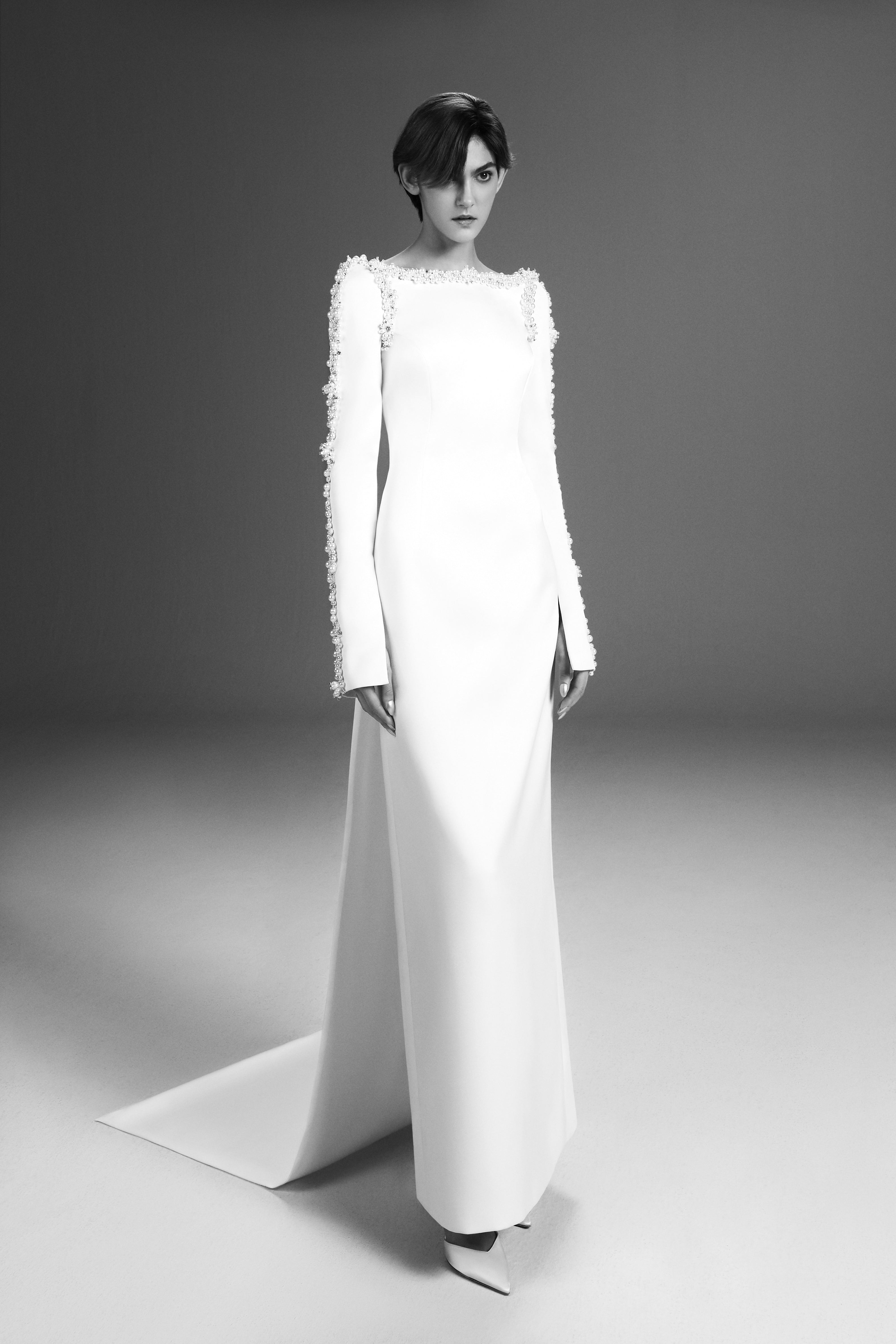 Viktor & Rolf Mariage Bridalwear Collection, Tales of Pearls column gown with intricate embroidery and elegant silhouette.