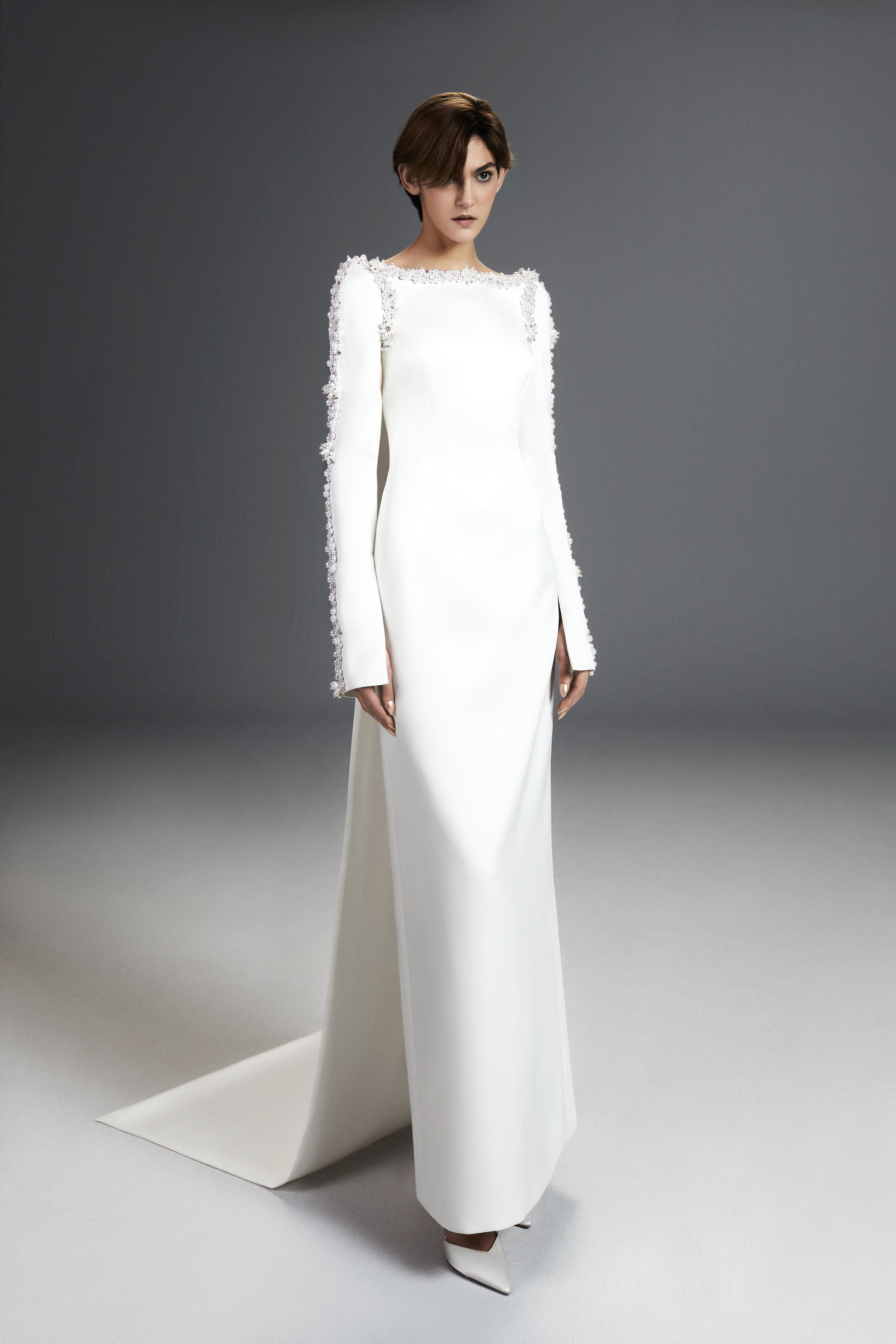 Viktor & Rolf Mariage Bridalwear Collection Tales of Pearls Column Gown, elegant white design with intricate pearl detailing.