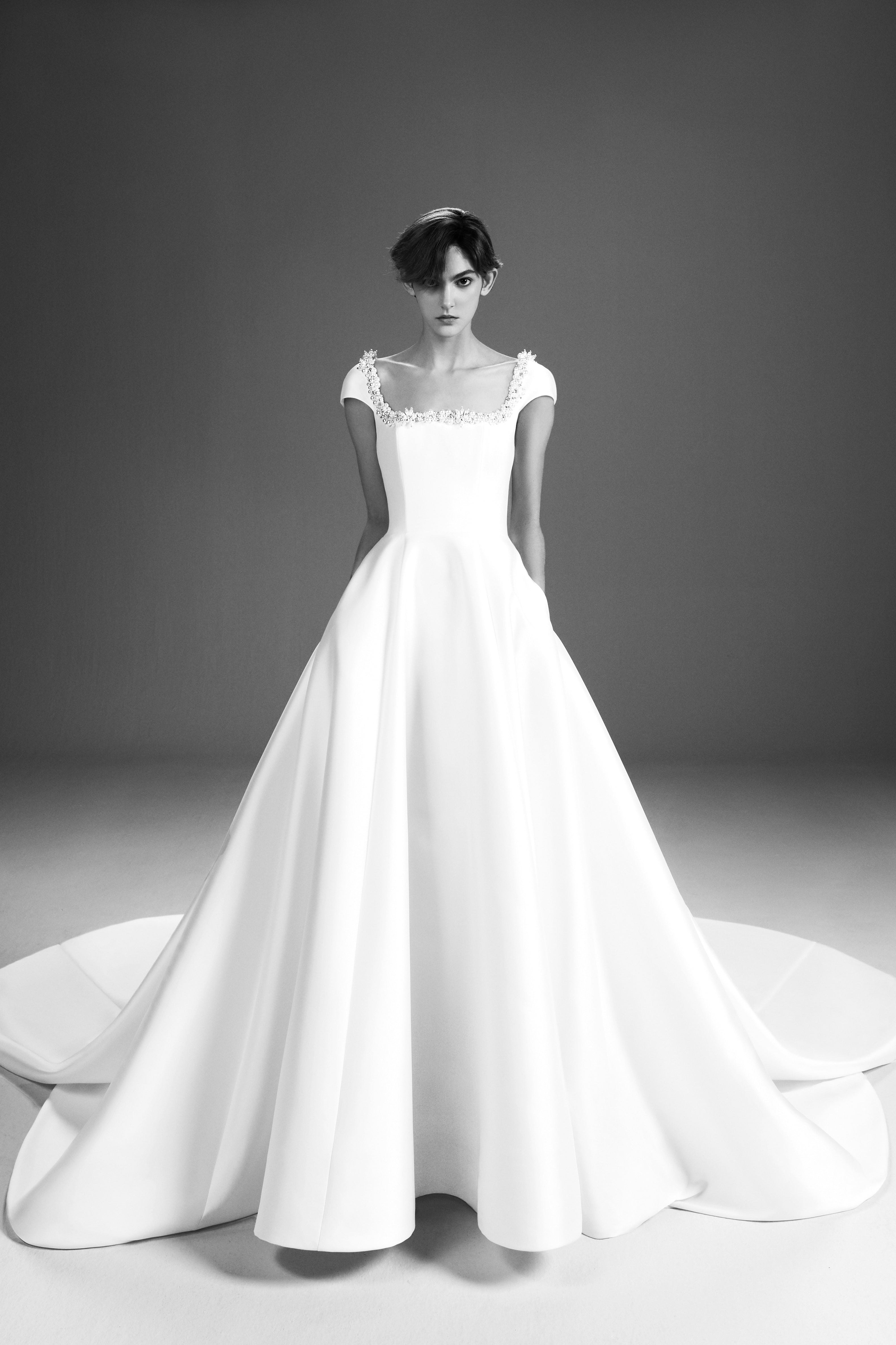 Viktor & Rolf Mariage Bridalwear Collection, Tales of Pearls gown, classic elegance with intricate pearl embellishments.