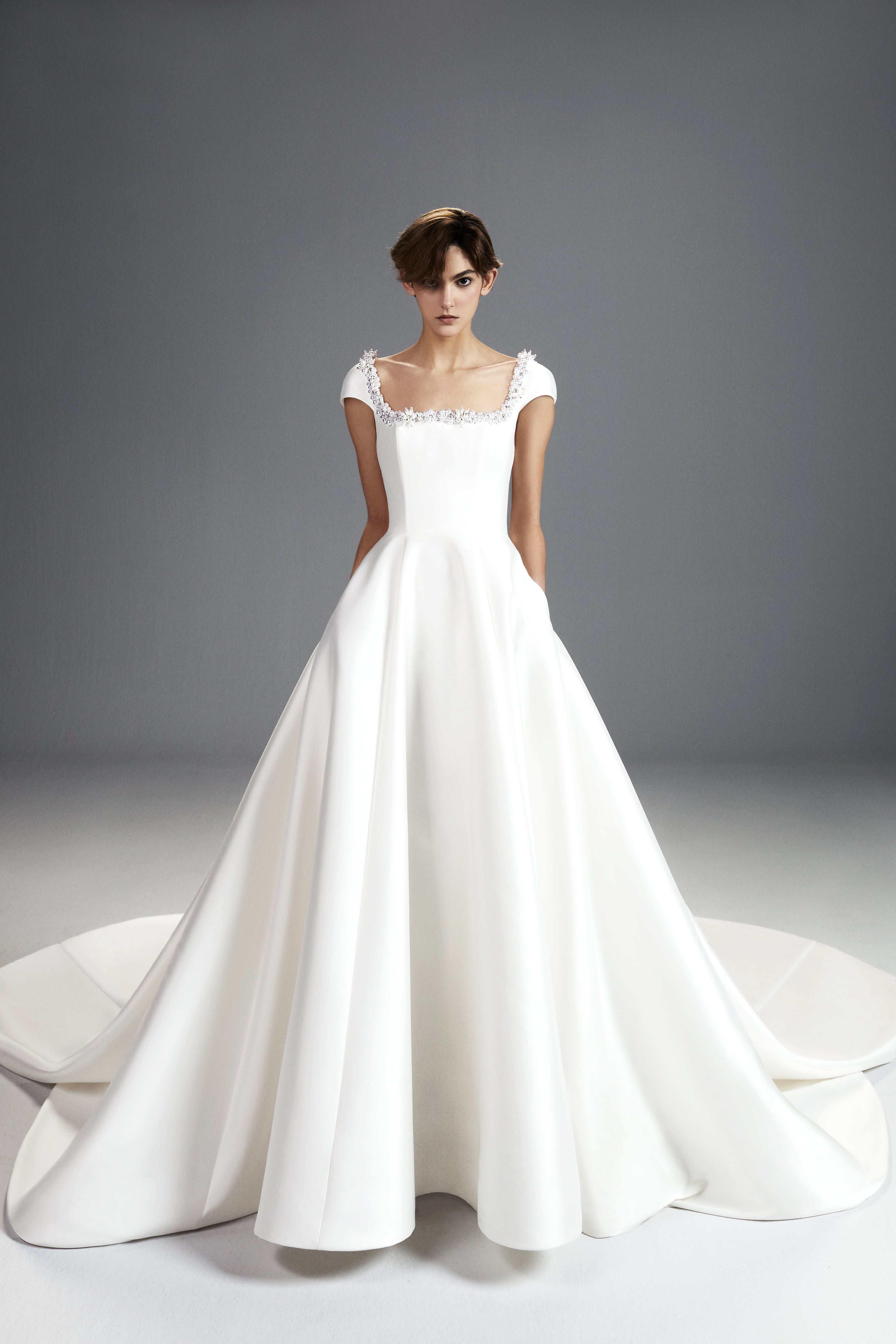 Viktor & Rolf Mariage Bridalwear Collection, Tales of Pearls gown, elegant design with intricate beaded neckline detailing.
