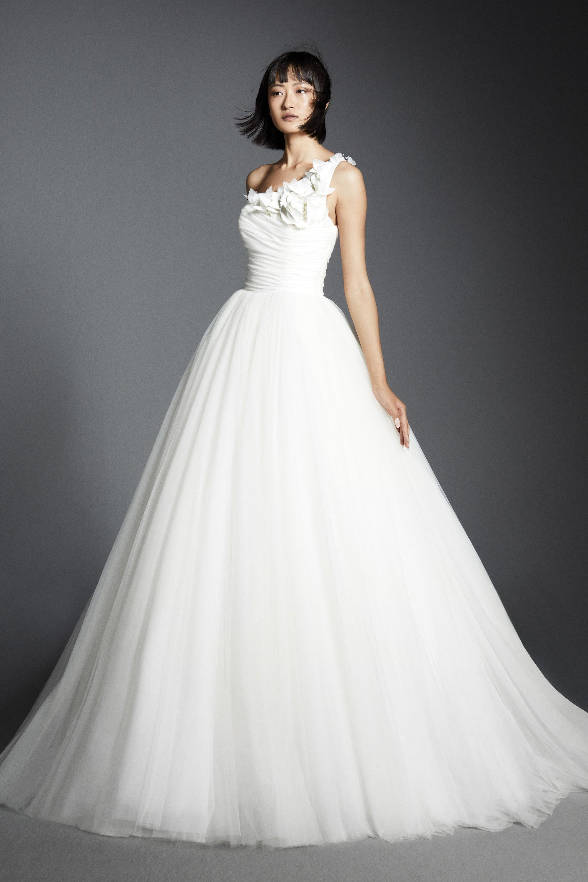 Lovely gown crafted from tulle with a mikado organza draped bodice