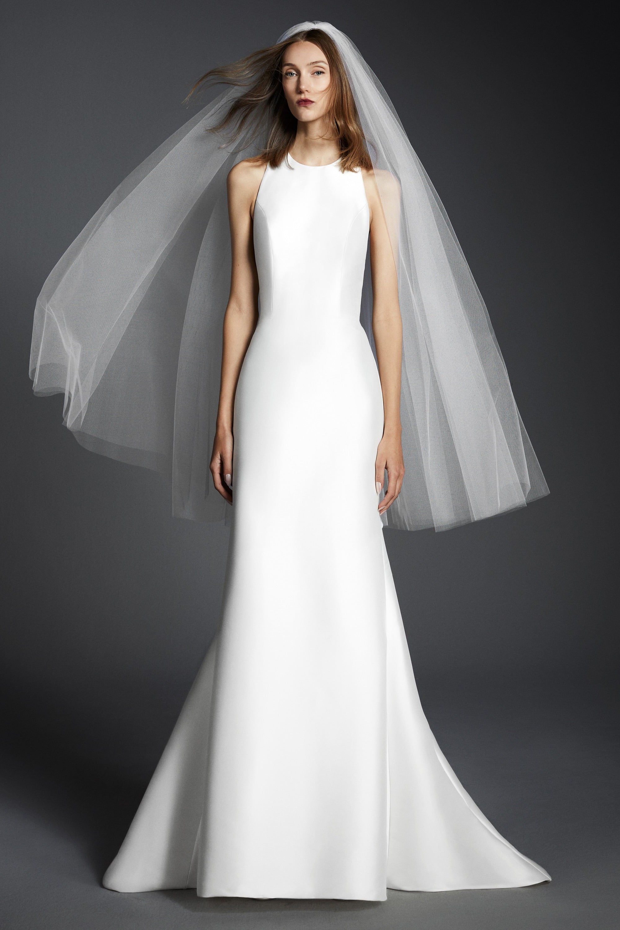 This elegant mermaid gown features a stretch mikado fabric which allows the dress to perfectly mold to the wearer’s body