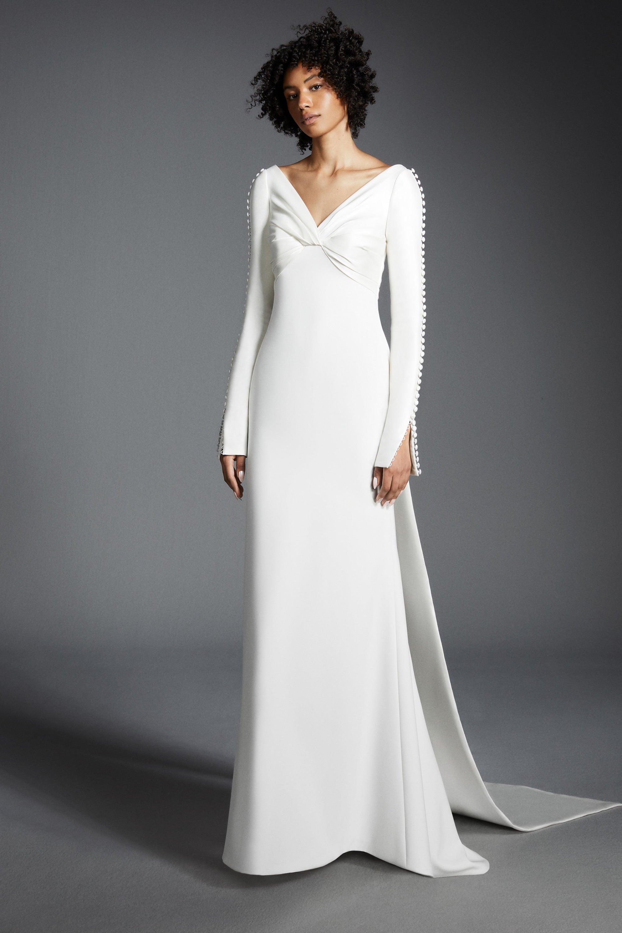 Chic mermaid gown featuring a draped stretch mikado empire bodice