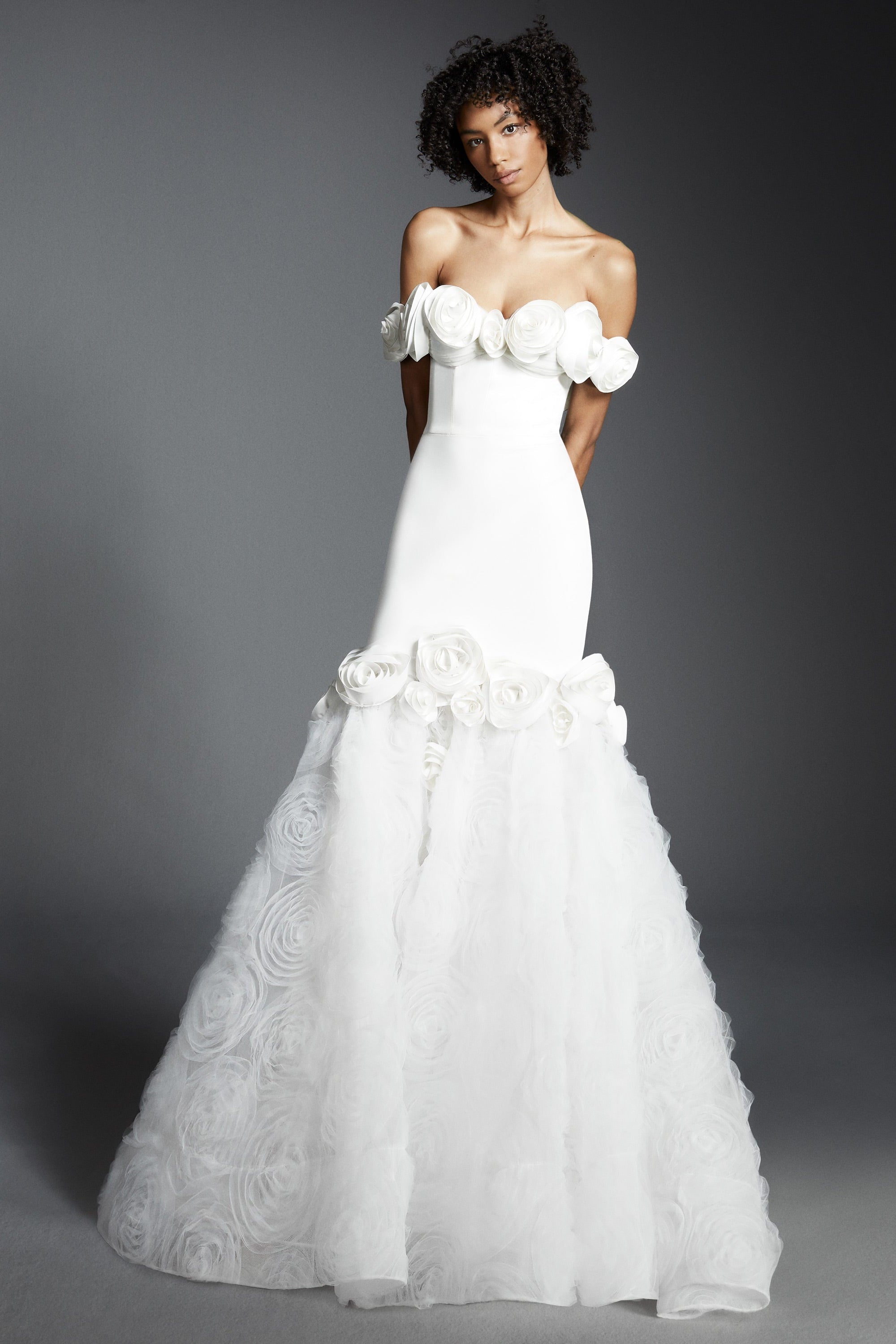 Elegant off-shoulder fit and flare silhouette, crafted from crepe with a slight stretch that sculpts the wearer's body