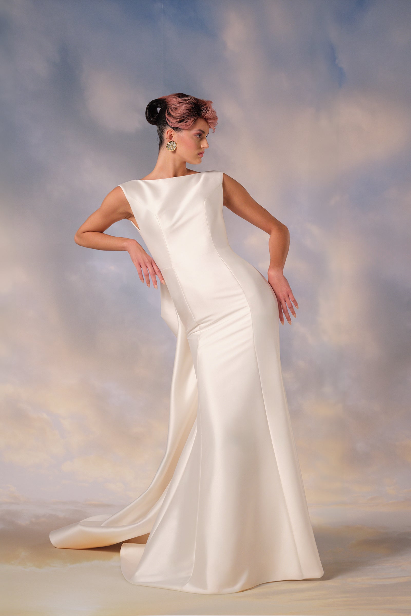 This stretch mikado gown combines a sleek mermaid silhouette with a plunging back, from the Viktor&Rolf Mariage collection.