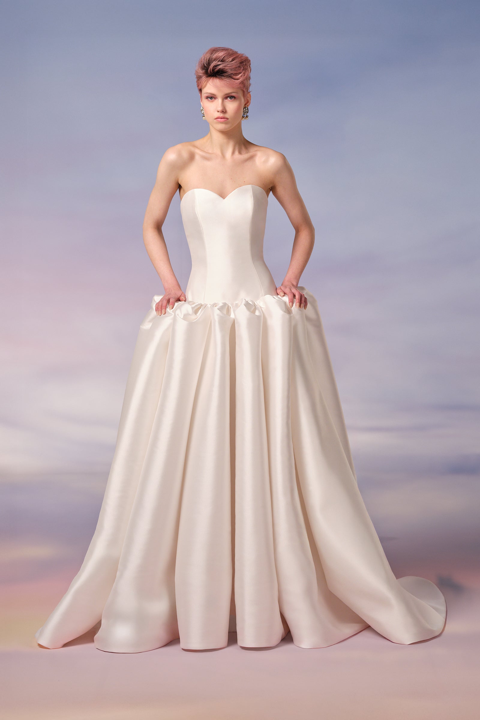 Crafted in mikado, this a-line gown features bold sculptural puffs at the dropped waist, from the Viktor&Rolf Mariage collection.