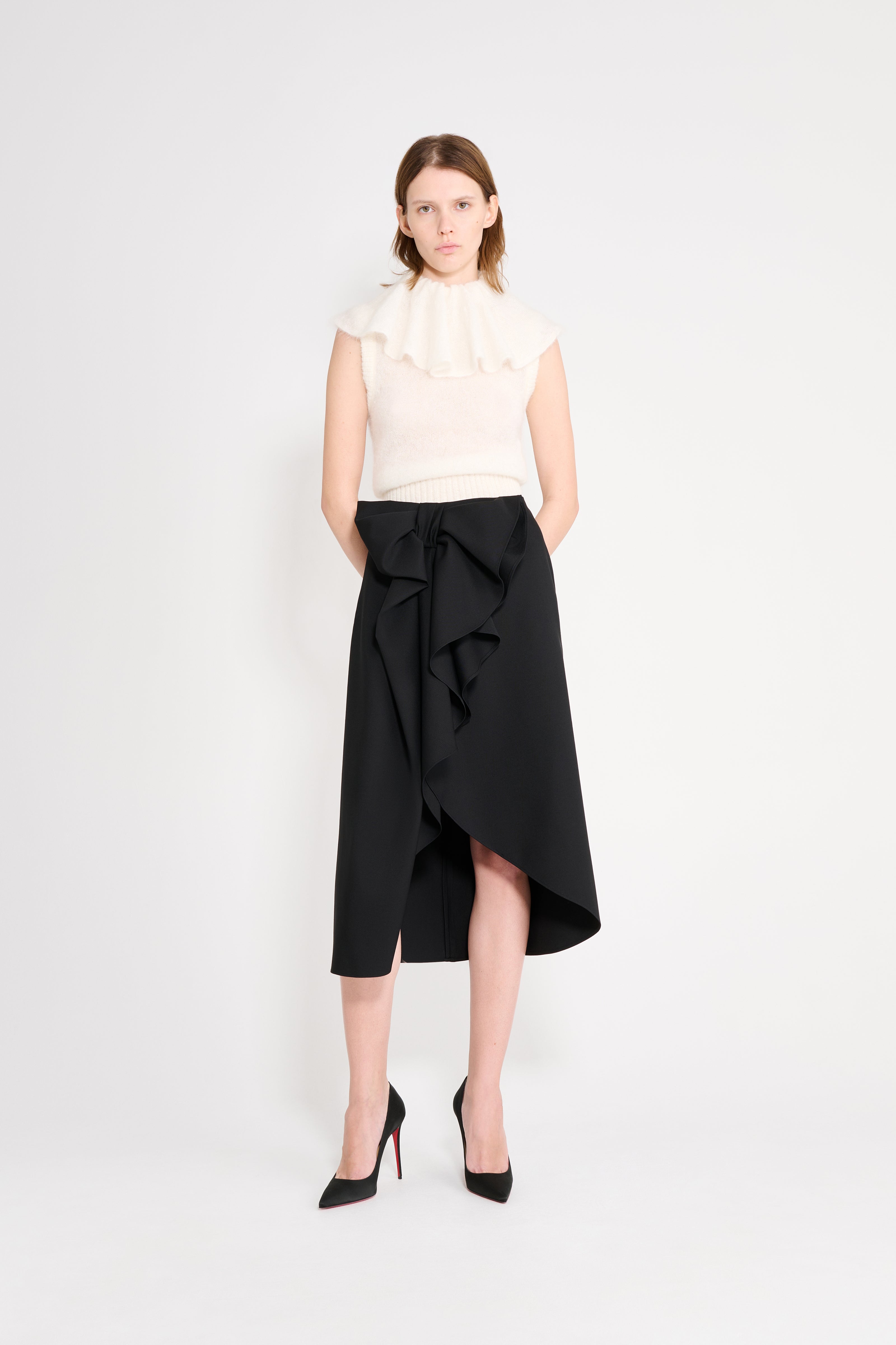 Model wearing a black wool skirt.