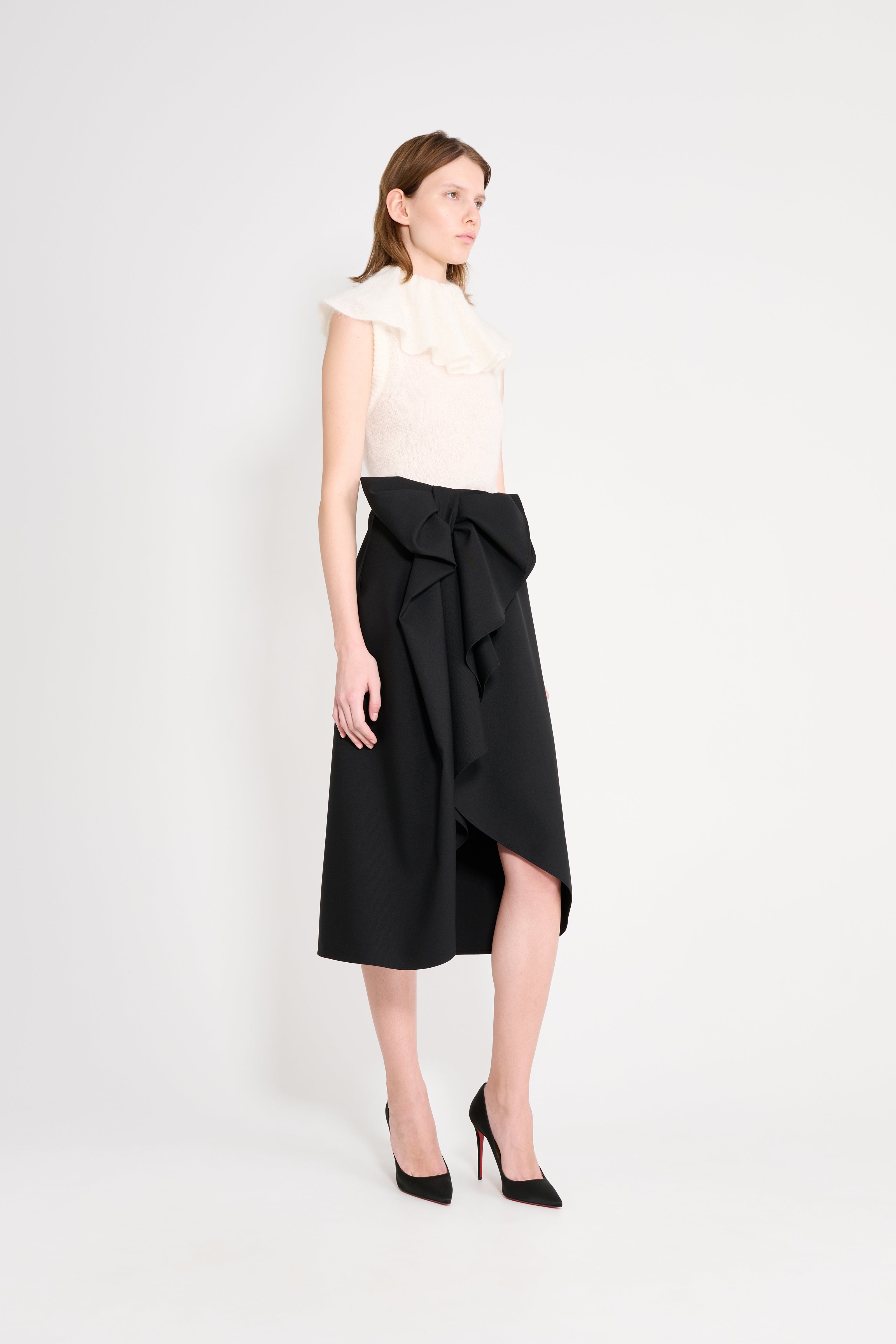 Model wearing a black wool skirt.