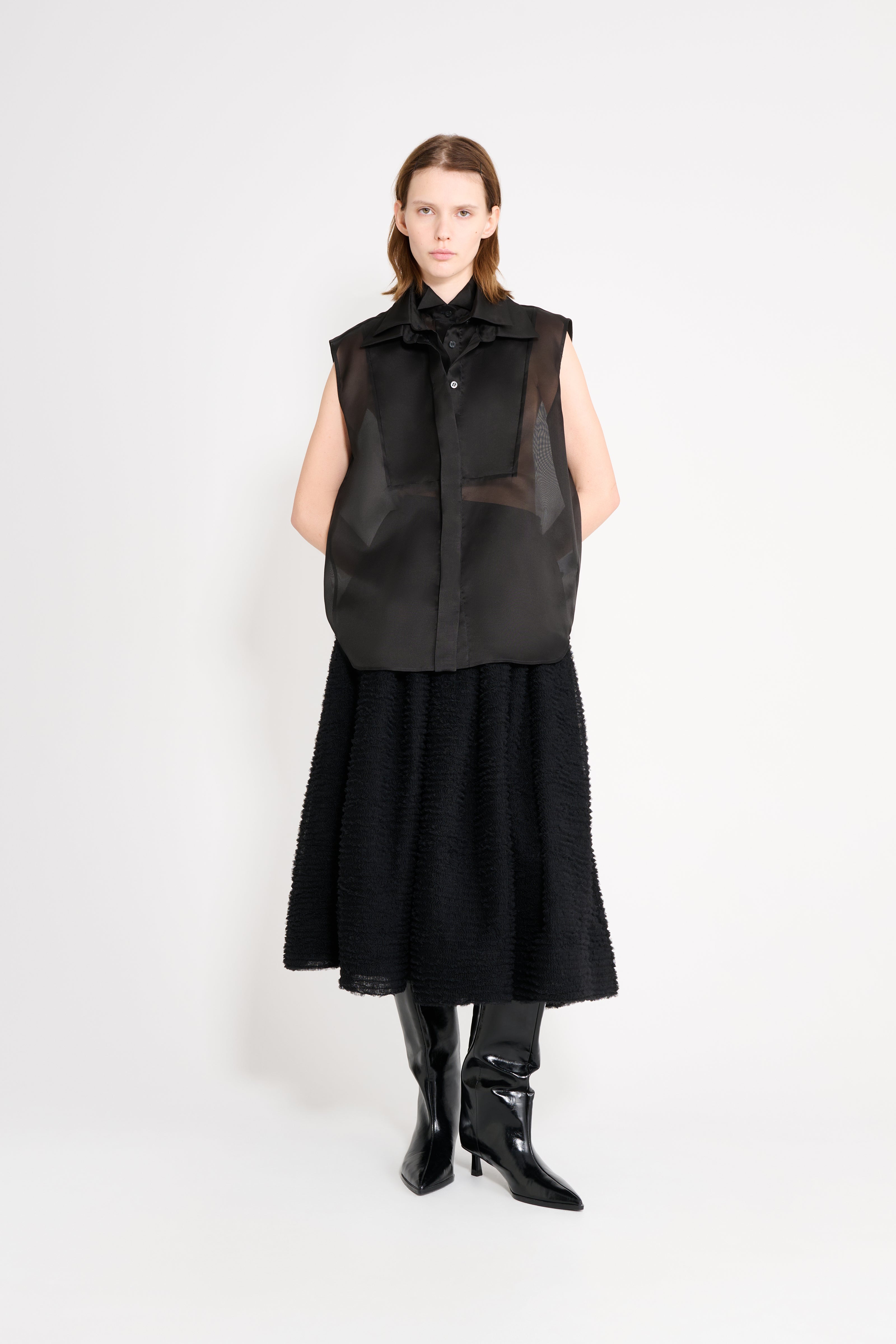 Model wearing a black shirt.