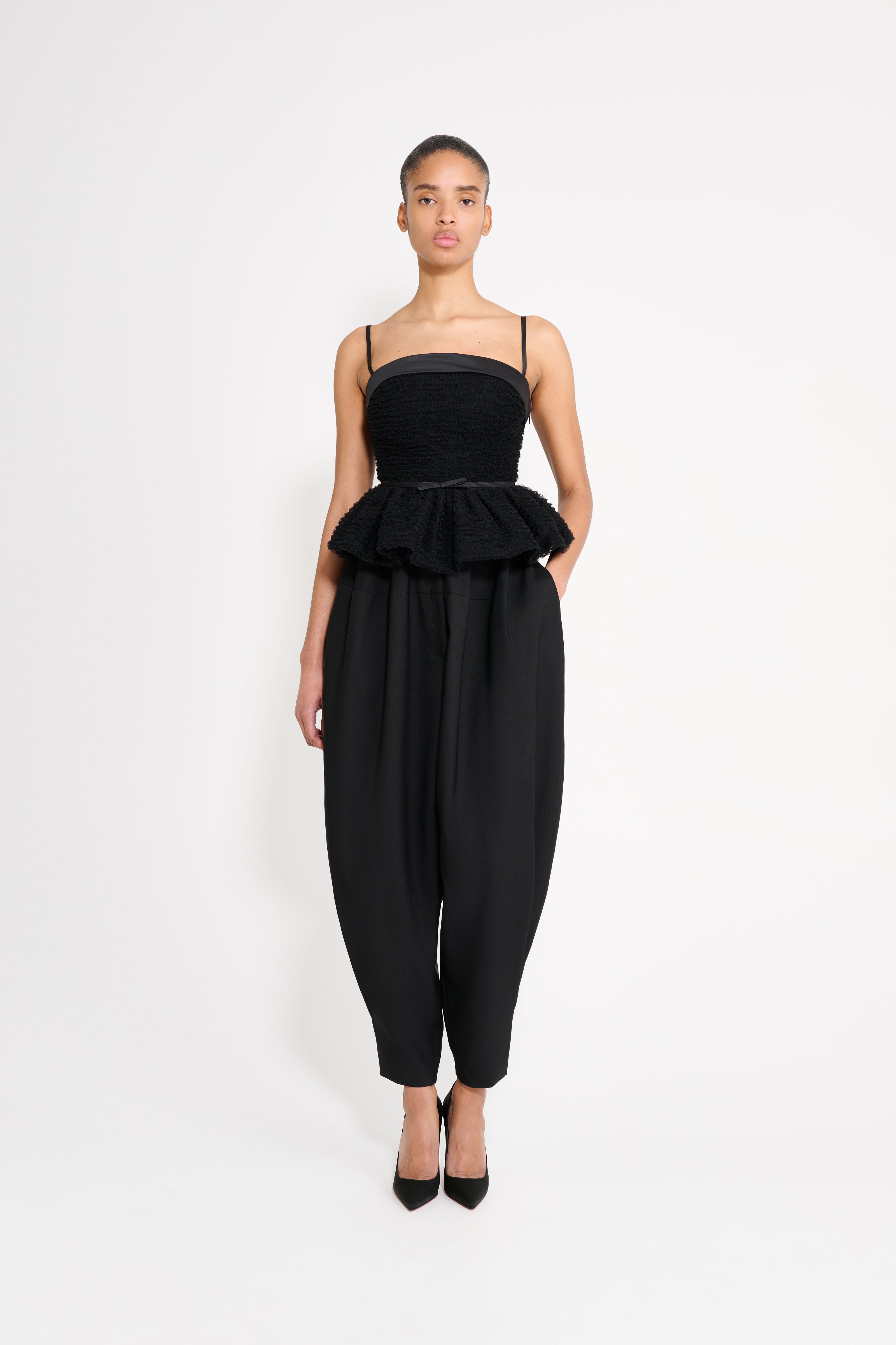 Model wearing a black top.