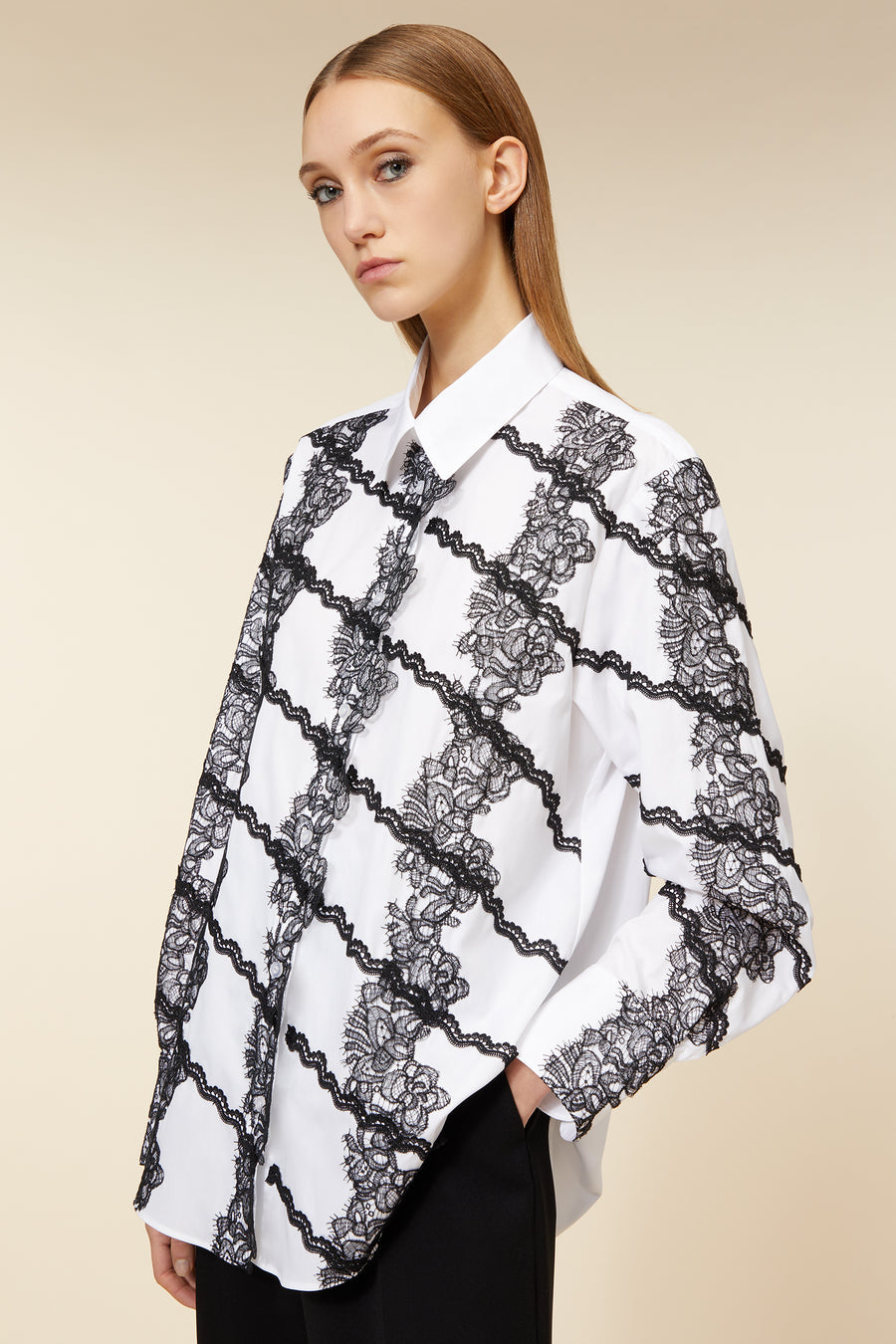 White shirt featuring intricate black lace floral patterns with a classic collar and loose, elegant fit design.