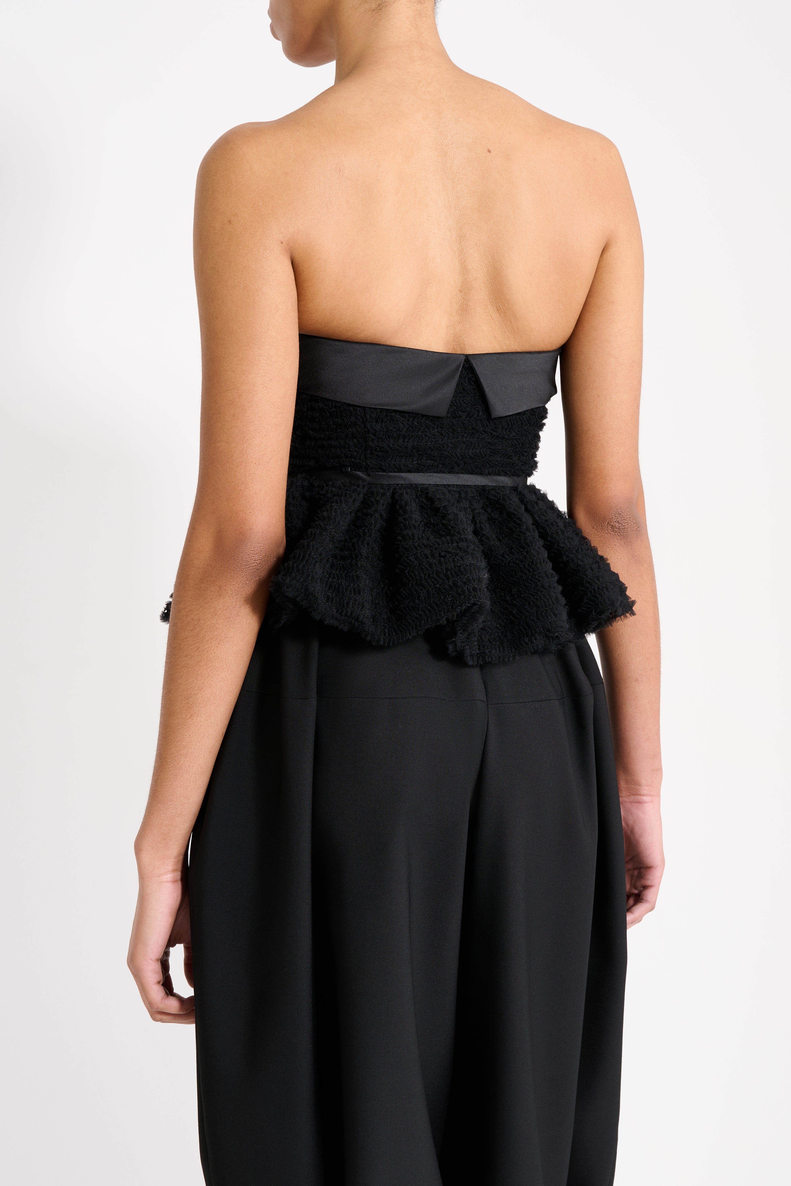 Close up on the black top from the back.