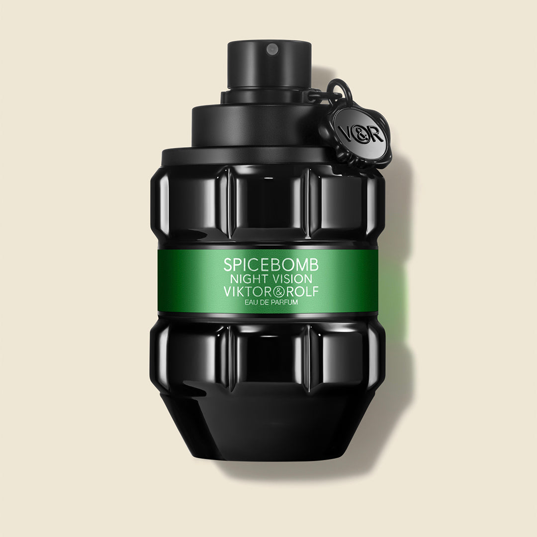 Spicebomb night vision bottle with green label on a beige background