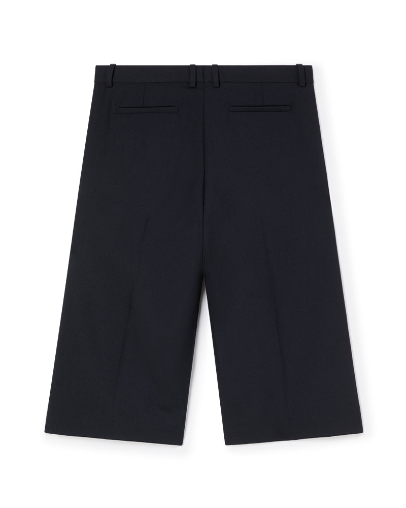 Tailored black wool blend culottes with a high waist, featuring belt loops and back welt pockets for a sophisticated look.