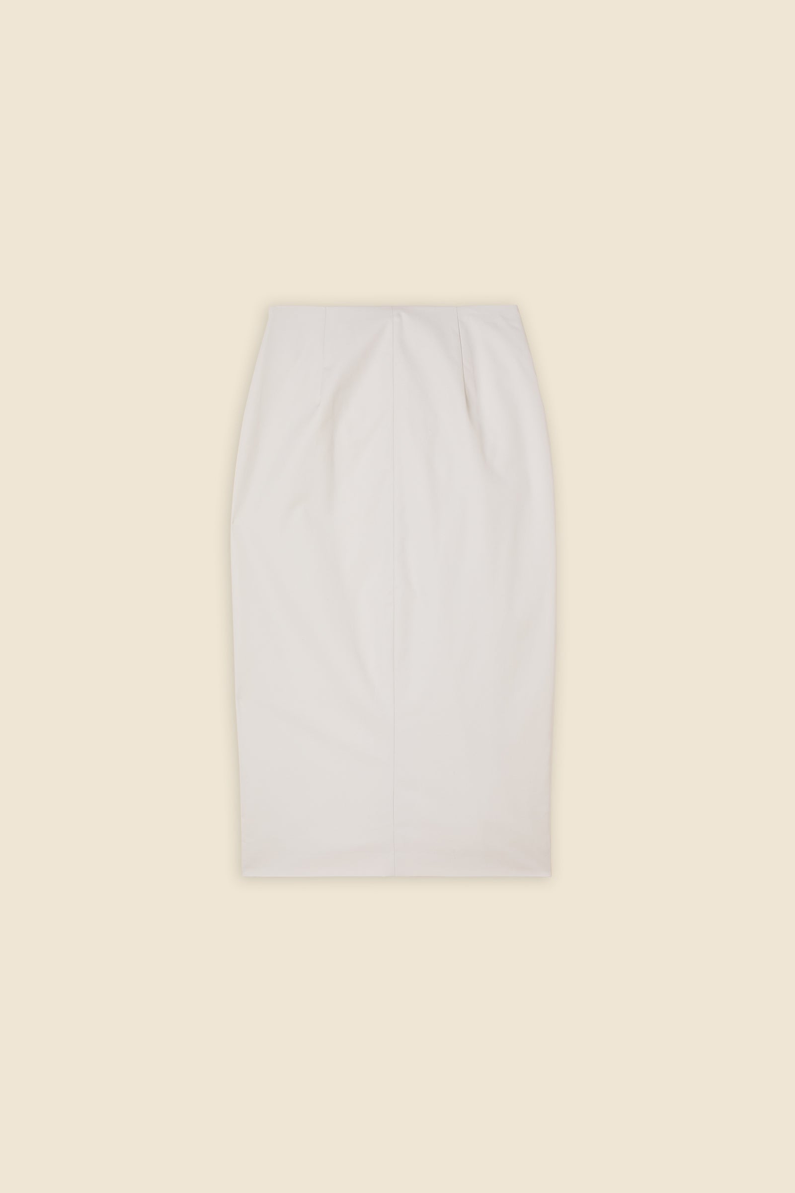 The craftmanship of the skirt reinterprets classic haute couture tuck ups into a modern silhouette from gabardine