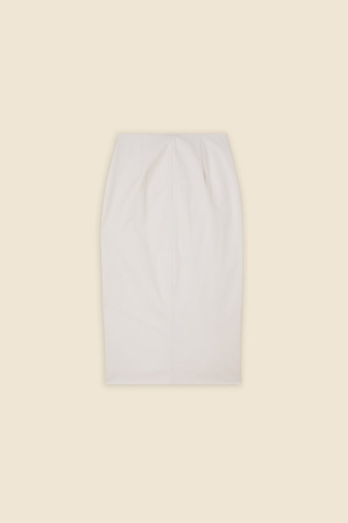The craftmanship of the skirt reinterprets classic haute couture tuck ups into a modern silhouette from gabardine