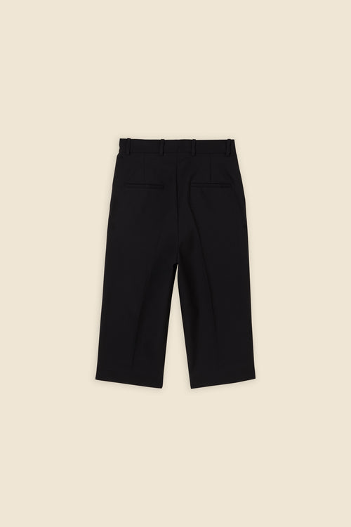 Crafted from wool, the high-waisted capri pant offers a tailored fit and timeless elegance