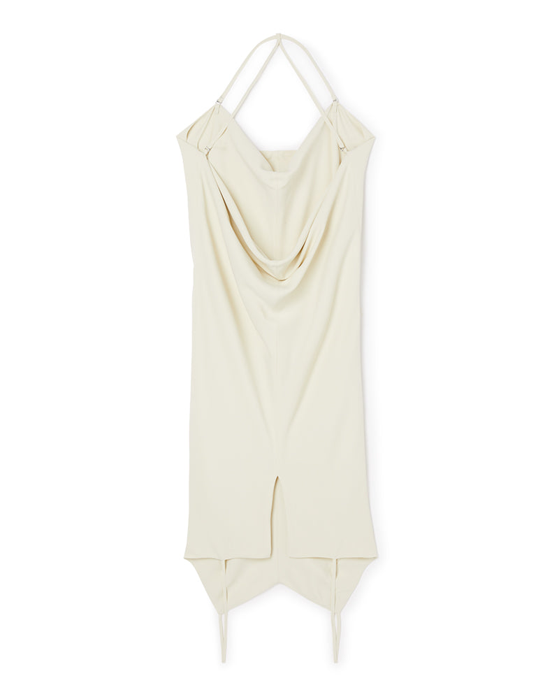 Cream draped slip dress featuring elegant spaghetti straps, asymmetrical hemline, and soft flowing fabric for a chic look.