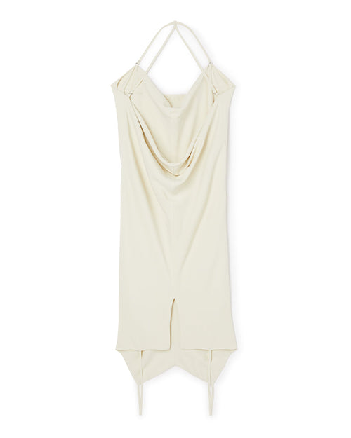Cream draped slip dress featuring elegant spaghetti straps, asymmetrical hemline, and soft flowing fabric for a chic look.
