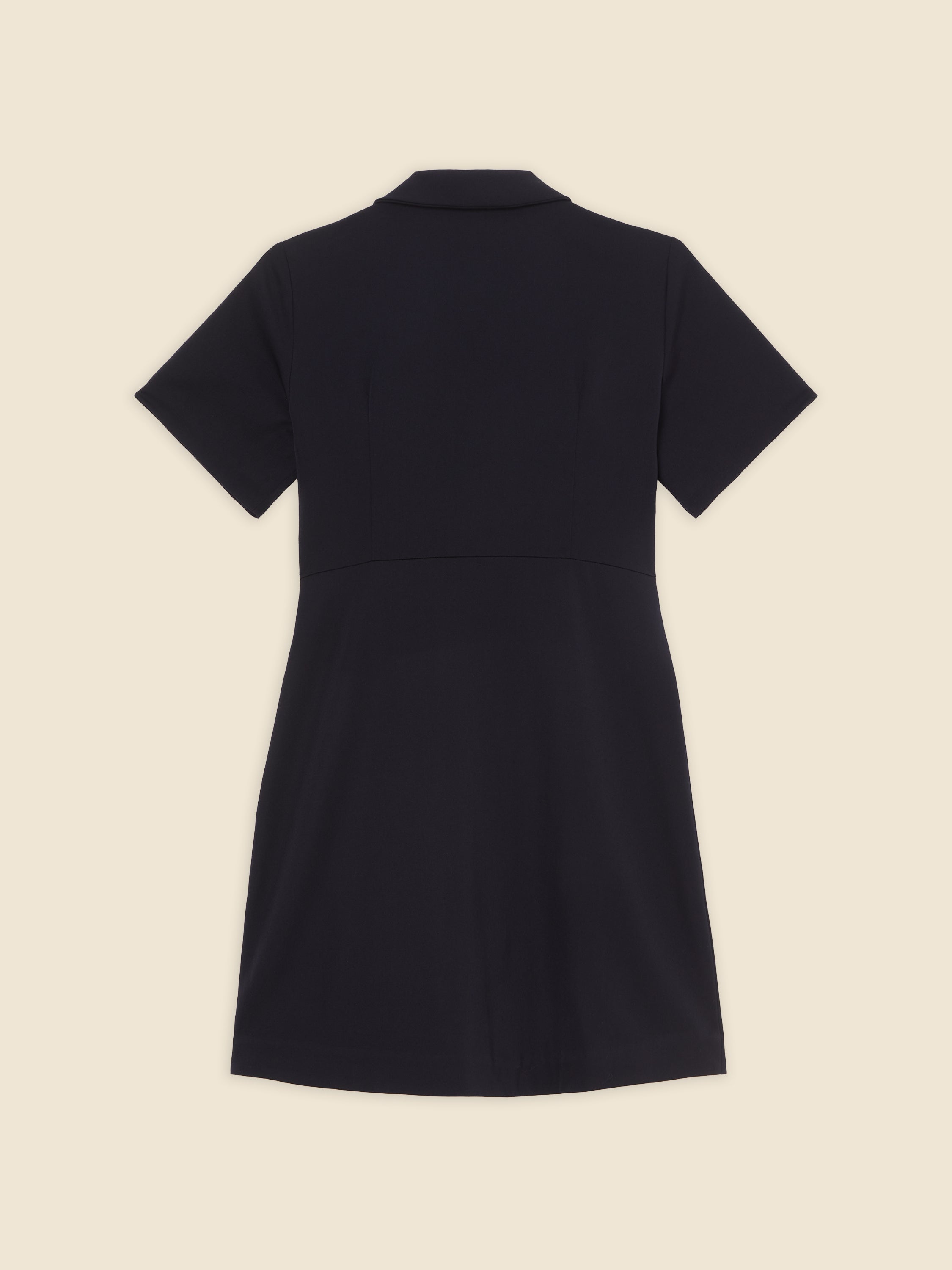 Black short-sleeve collared dress on cream background, showcasing minimalist design and tailored fit.