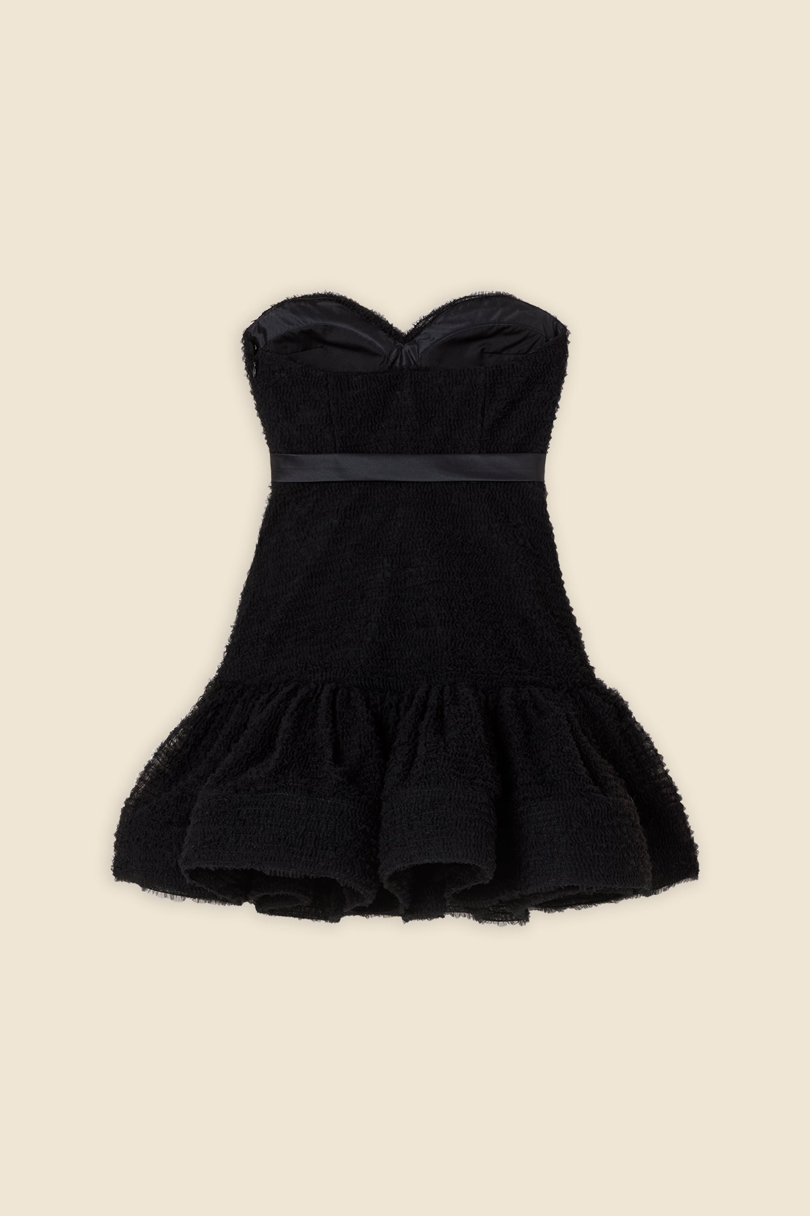 Inspired by the tulle from the ‘late stage capitalism waltz’ haute couture collection, the dress features hand crafted tulle ruffles for a feminine texture