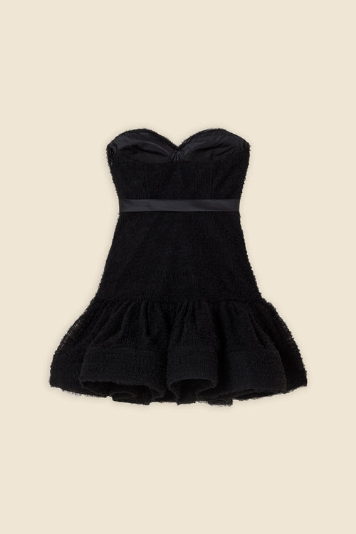 Inspired by the tulle from the ‘late stage capitalism waltz’ haute couture collection, the dress features hand crafted tulle ruffles for a feminine texture
