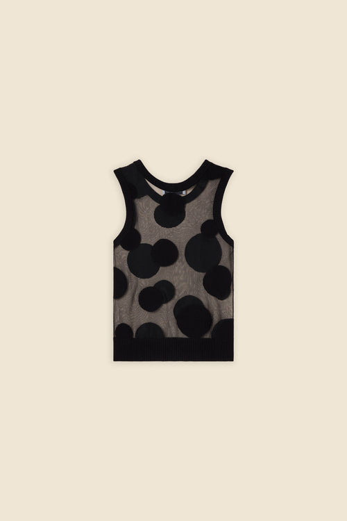 The classic pattern of the top is given a modern twist with intricate polka dot hole design on knit jacquard