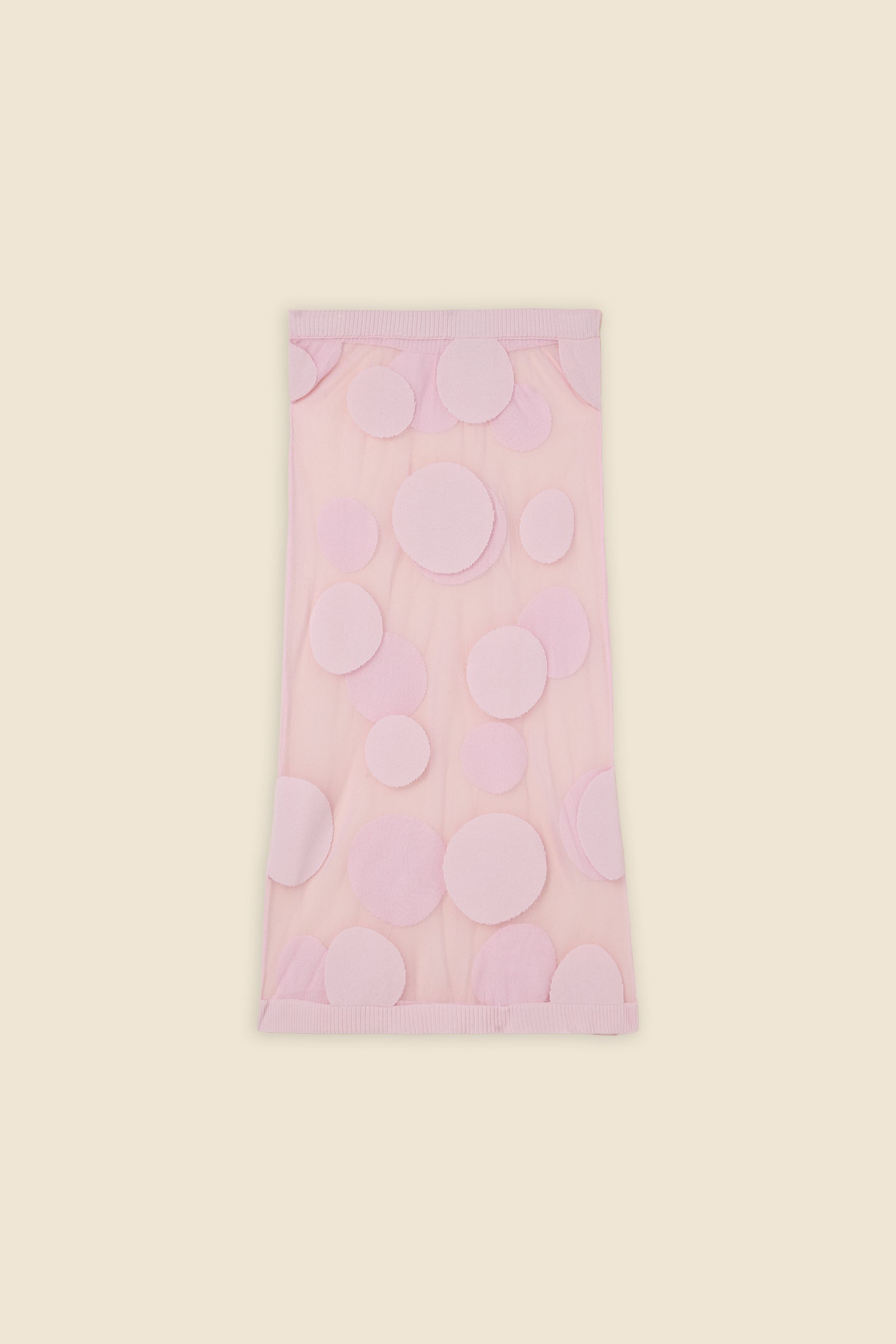 The classic pattern of the skirt is given a modern twist with intricate polka dot hole design on knit jacquard