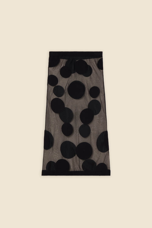 The classic pattern of the skirt is given a modern twist with intricate polka dot hole design on knit jacquard