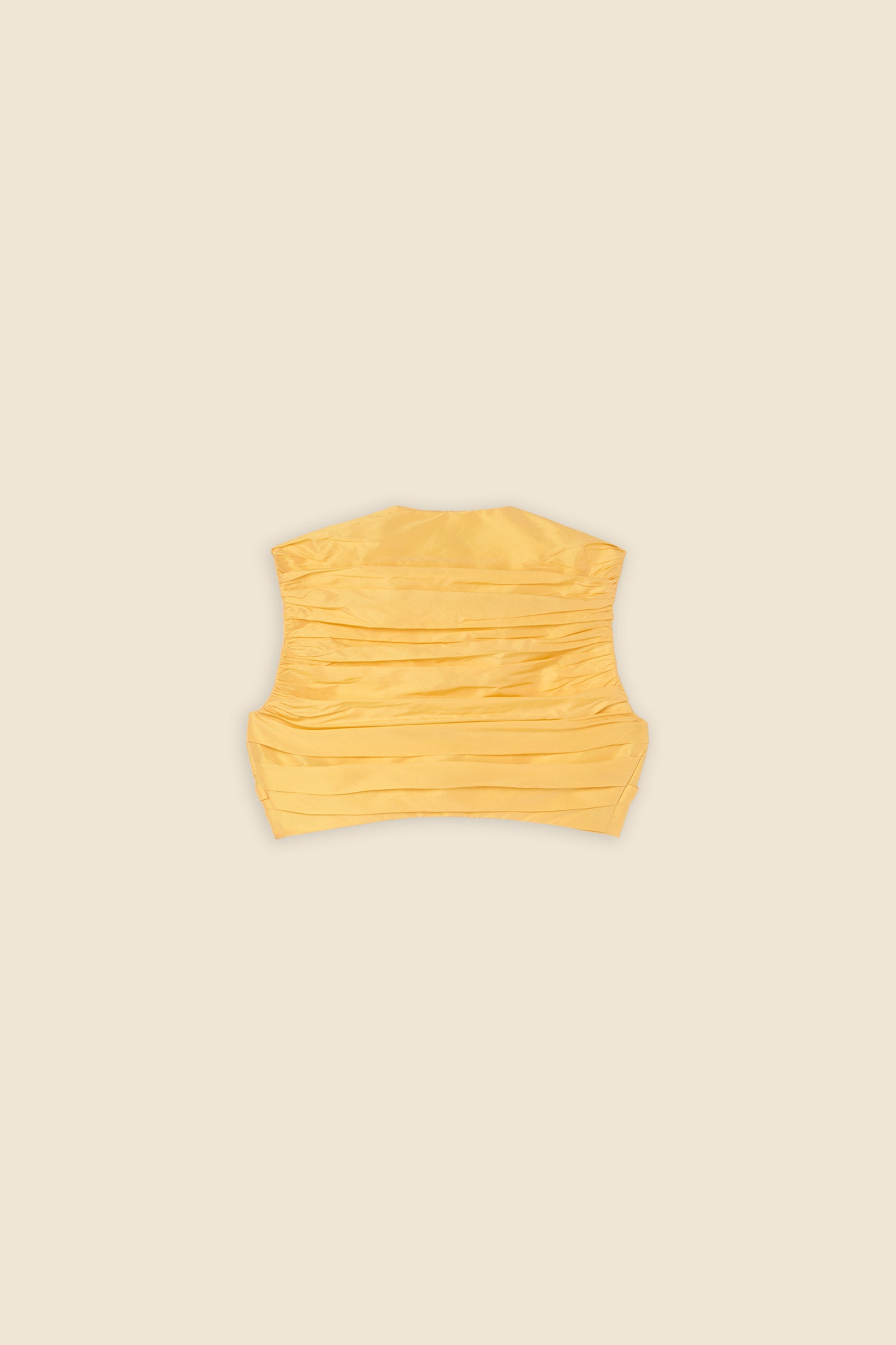 The meticulously placed pleats and silk-blend taffeta define the elegance of the top, reflecting classic haute couture craftsmanship with a modern edge