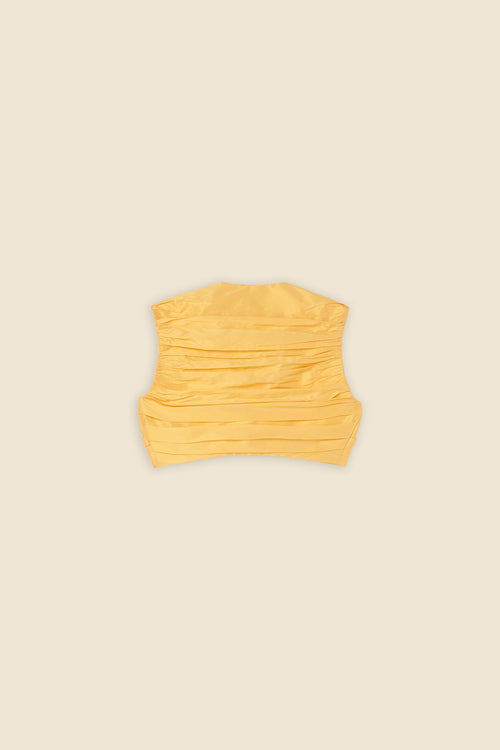 The meticulously placed pleats and silk-blend taffeta define the elegance of the top, reflecting classic haute couture craftsmanship with a modern edge