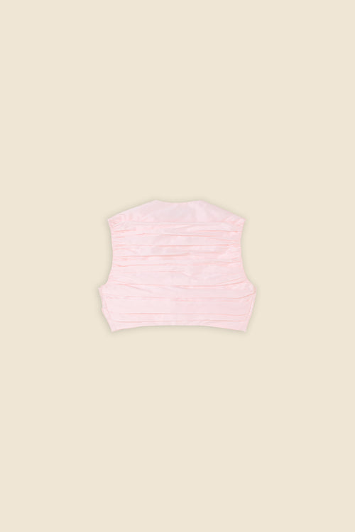 The meticulously placed pleats and silk-blend taffeta define the elegance of the top, reflecting classic haute couture craftsmanship with a modern edge