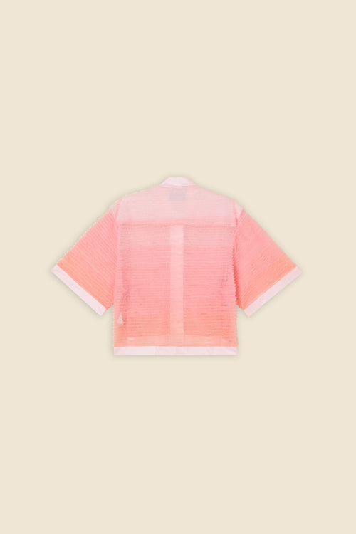 Inspired by the tulle from the ‘late stage capitalism waltz’ haute couture collection, the shirt features hand crafted tulle ruffles for a feminine texture