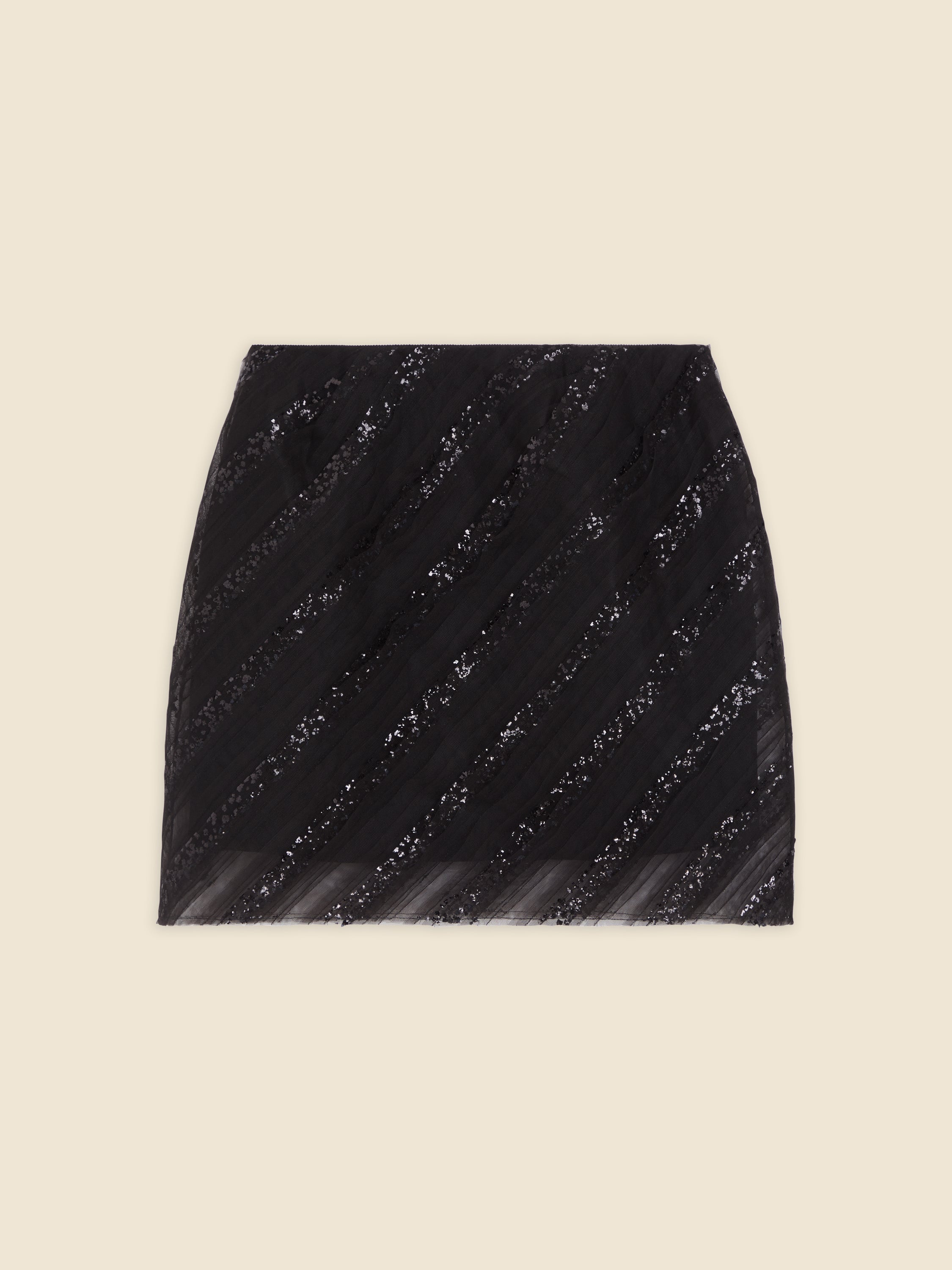 Black sequin mini skirt with diagonally striped pattern on a beige background, offering elegant evening wear.