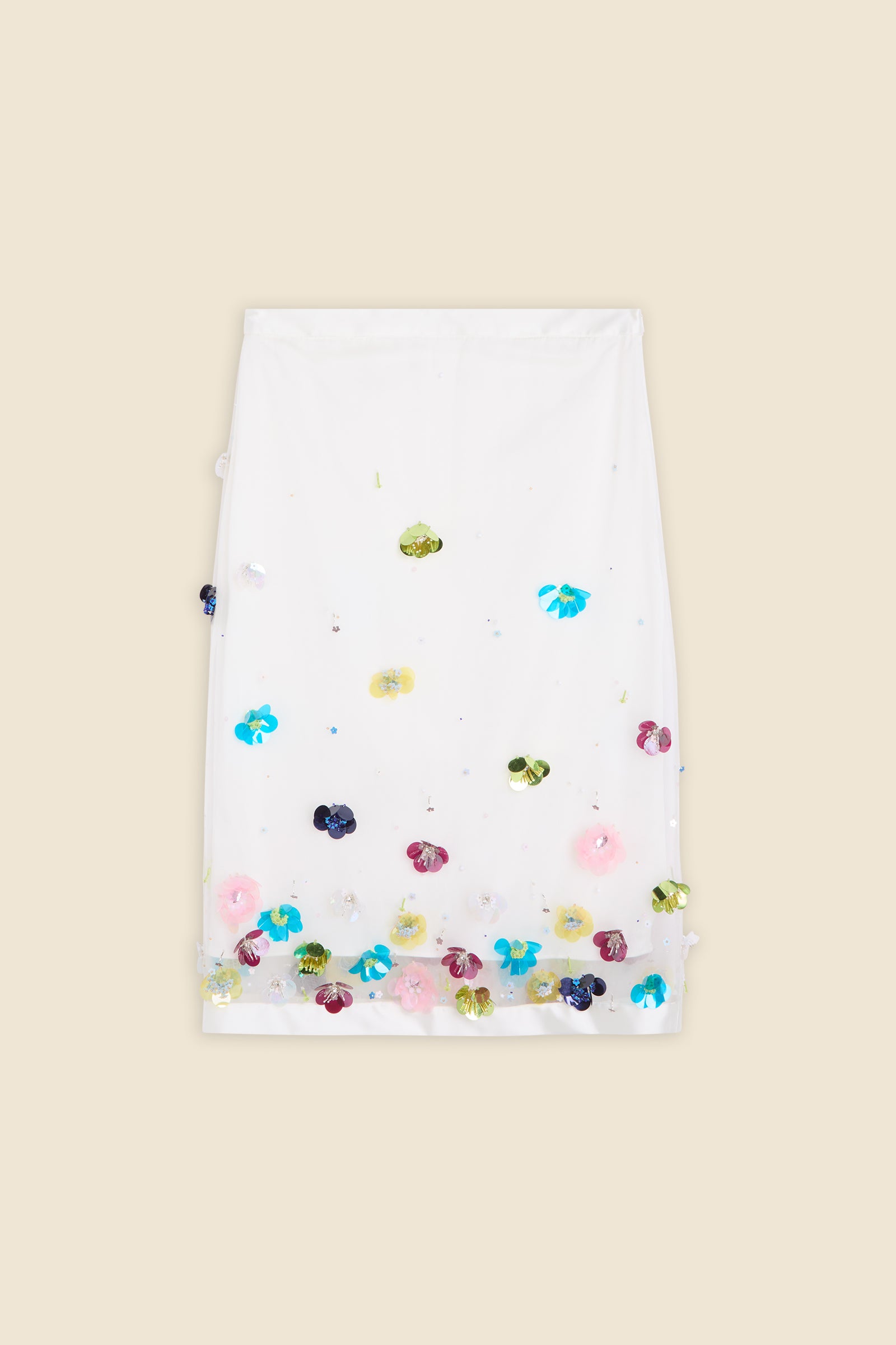With hand-applied paillettes and crystals on silk organza featuring the satin edges, the skirt transforms classic floral embroidery into a modern piece