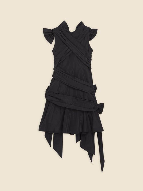 Black wrap dress with layered design and ruffled sleeves, featuring multiple overlapping fabric straps.