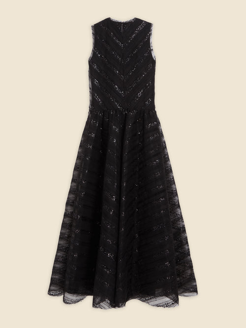 Sleeveless black lace evening gown with intricate chevron pattern and flowing A-line skirt on neutral background.